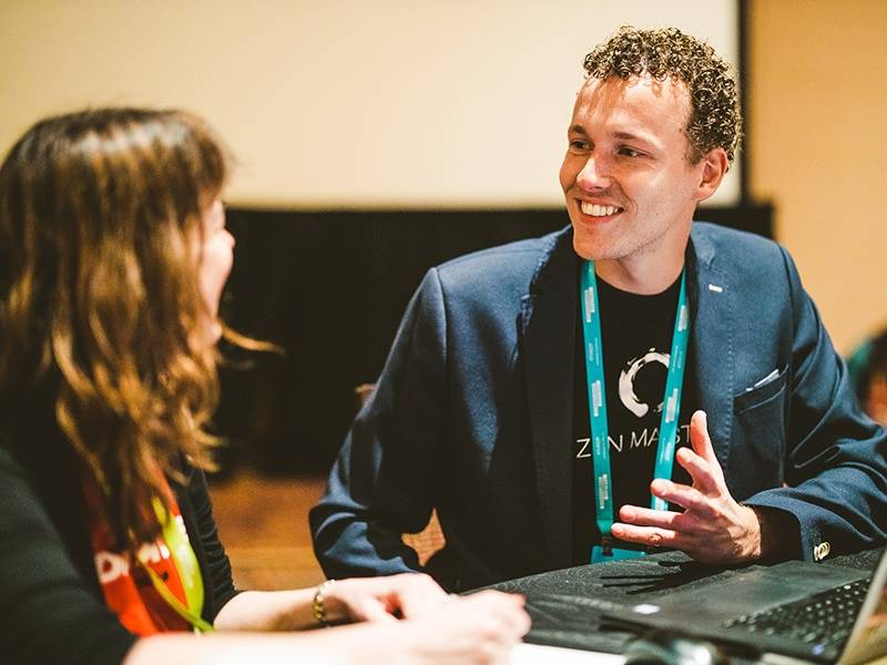 Tableau Visionary interacting with a member of the community