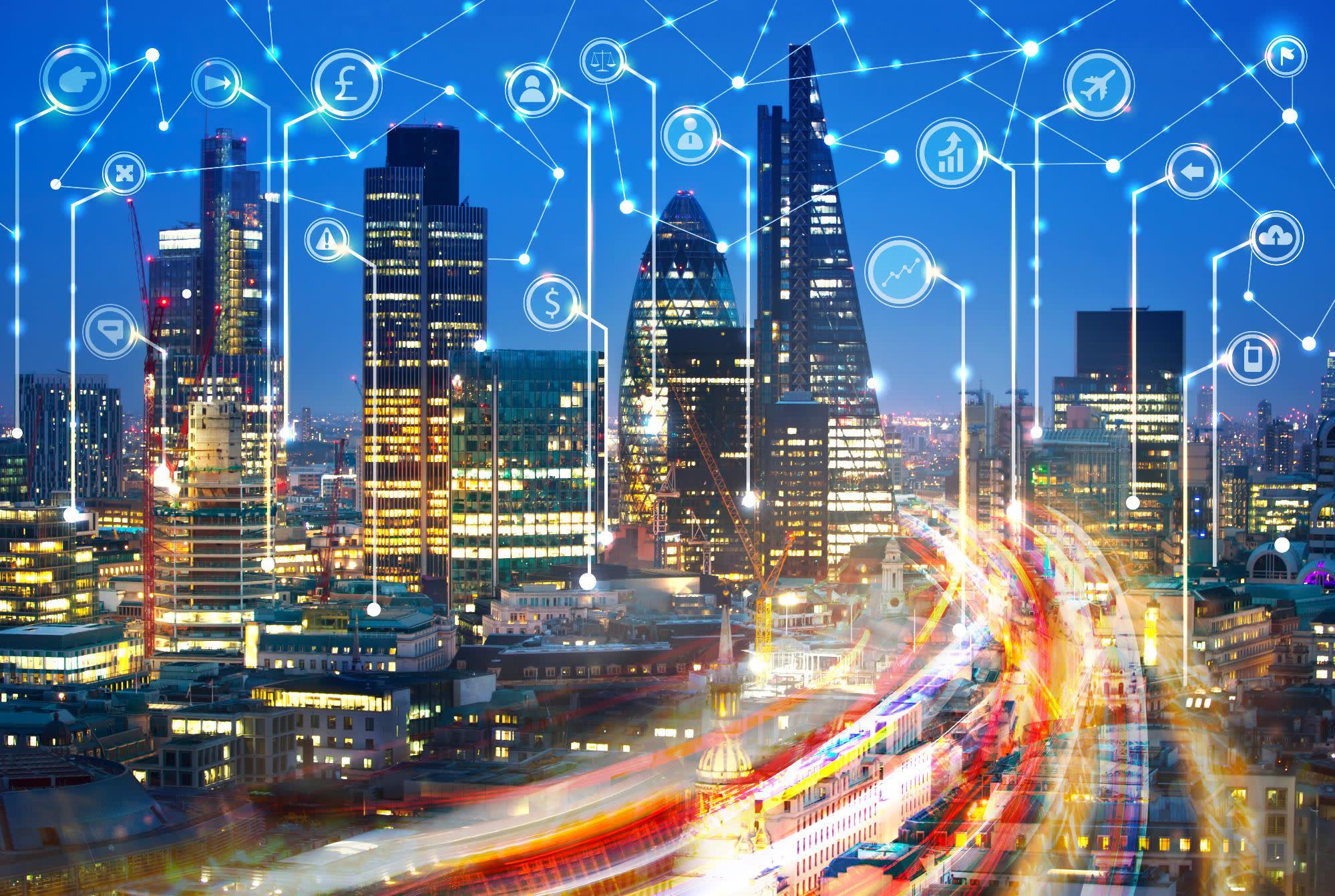 City at night with an overlay of interconnected lines and symbols for different app services