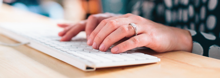 Hands on a keyboard.