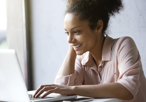 Happy woman using a computer