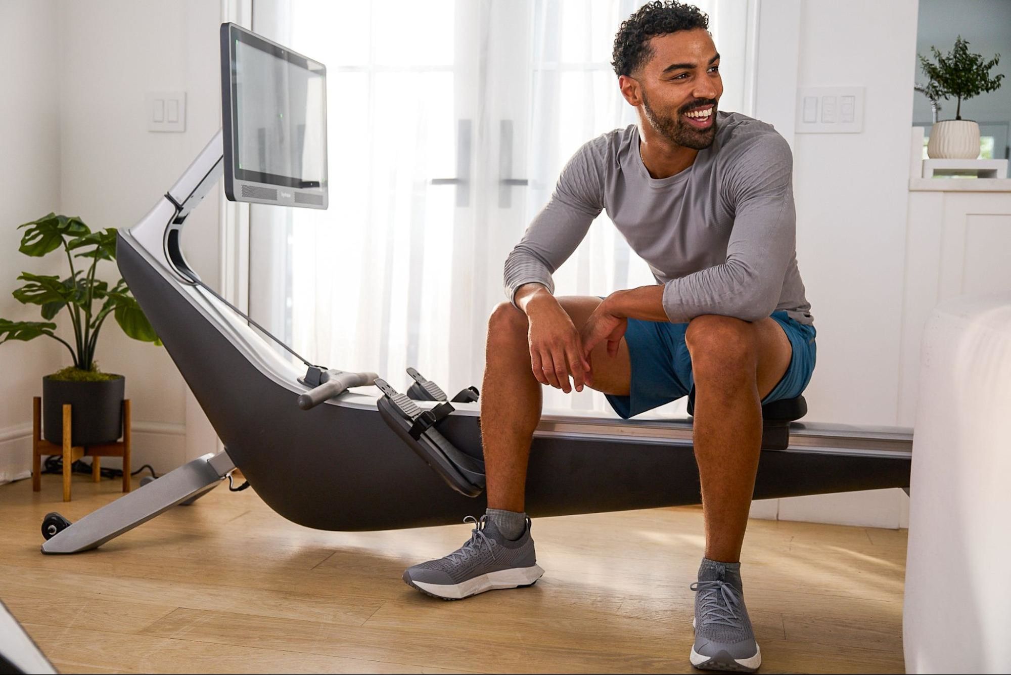 Man uses a rowing machine for cross-training.