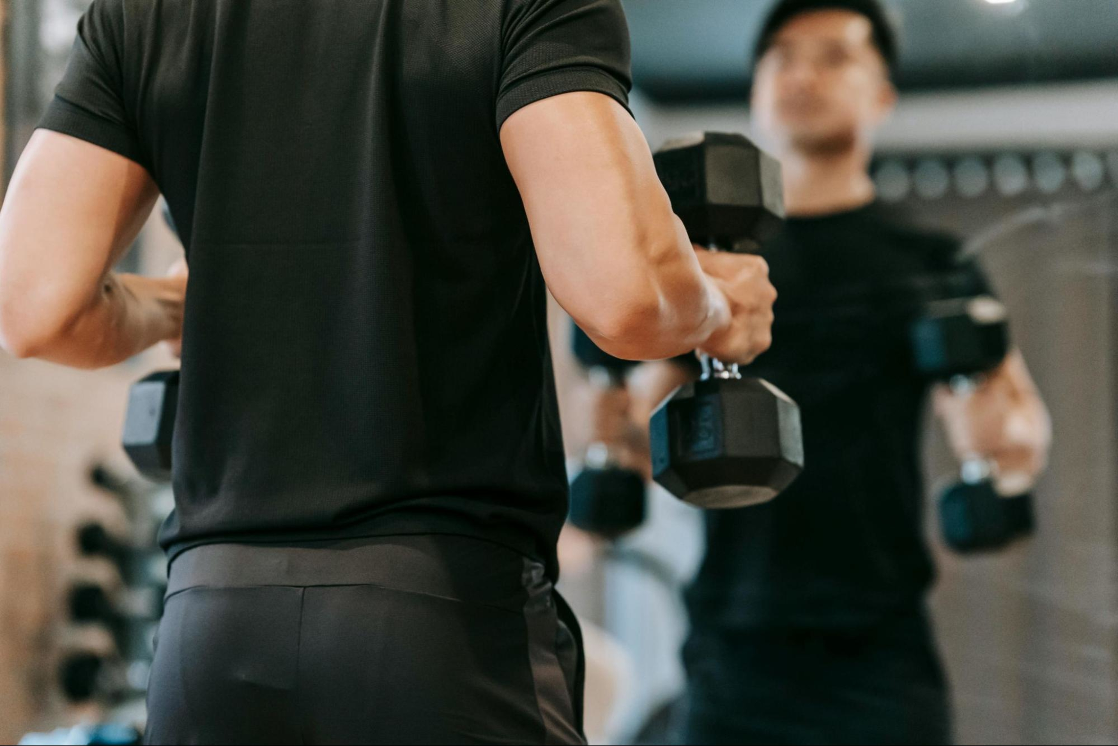 Man does a 30-minute HIIT workout with weights.