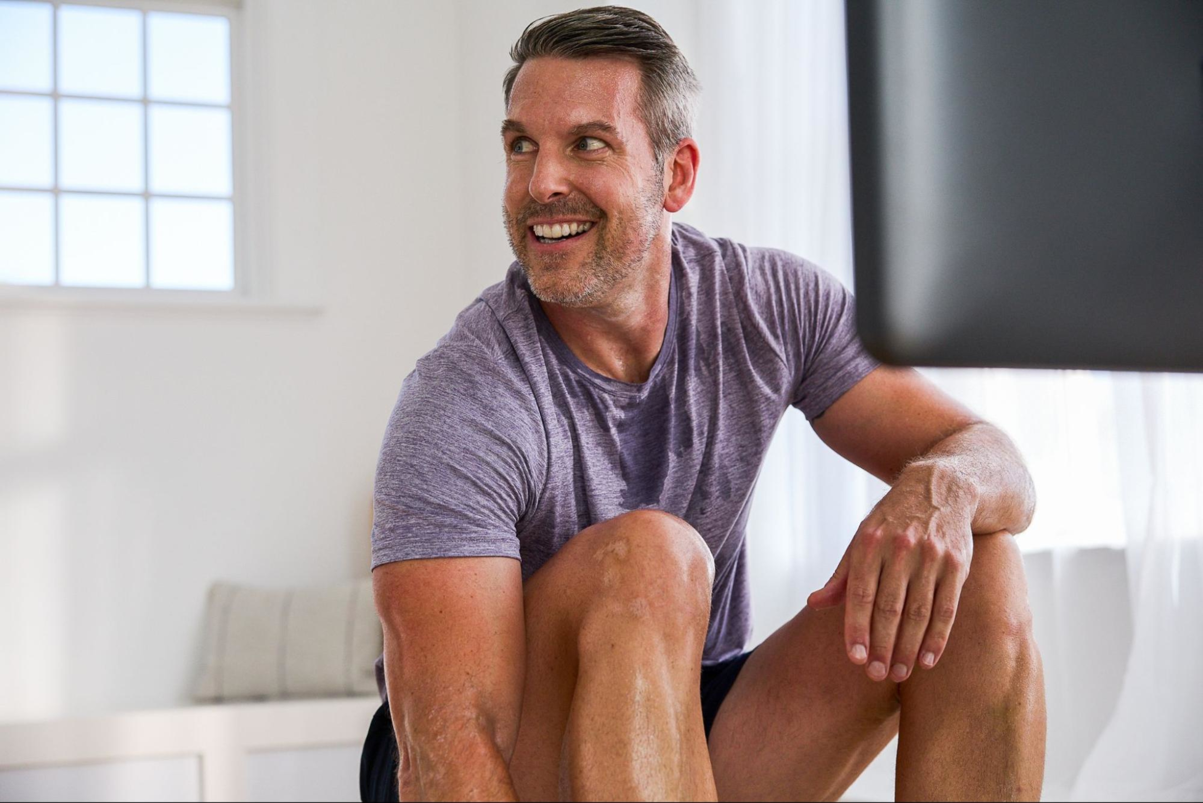 Man works out on a rowing machine for its many cardio benefits.