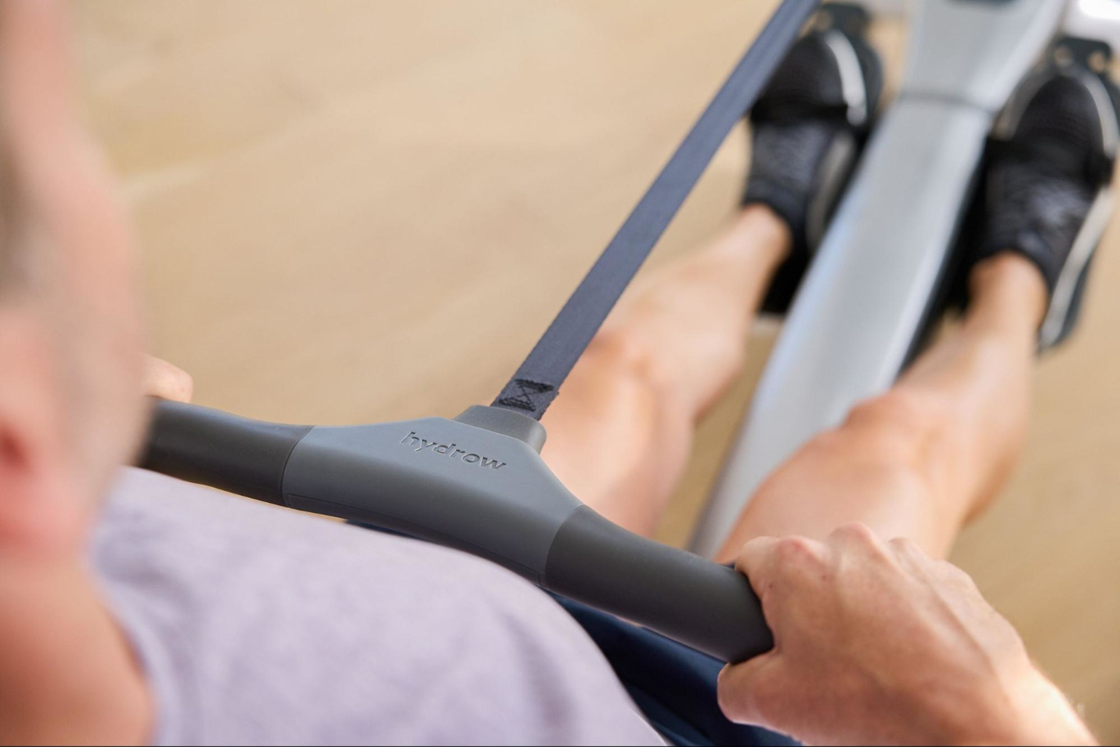 Man uses a rowing machine with shin splints because it is low-impact and doesn't worsen his symptoms.