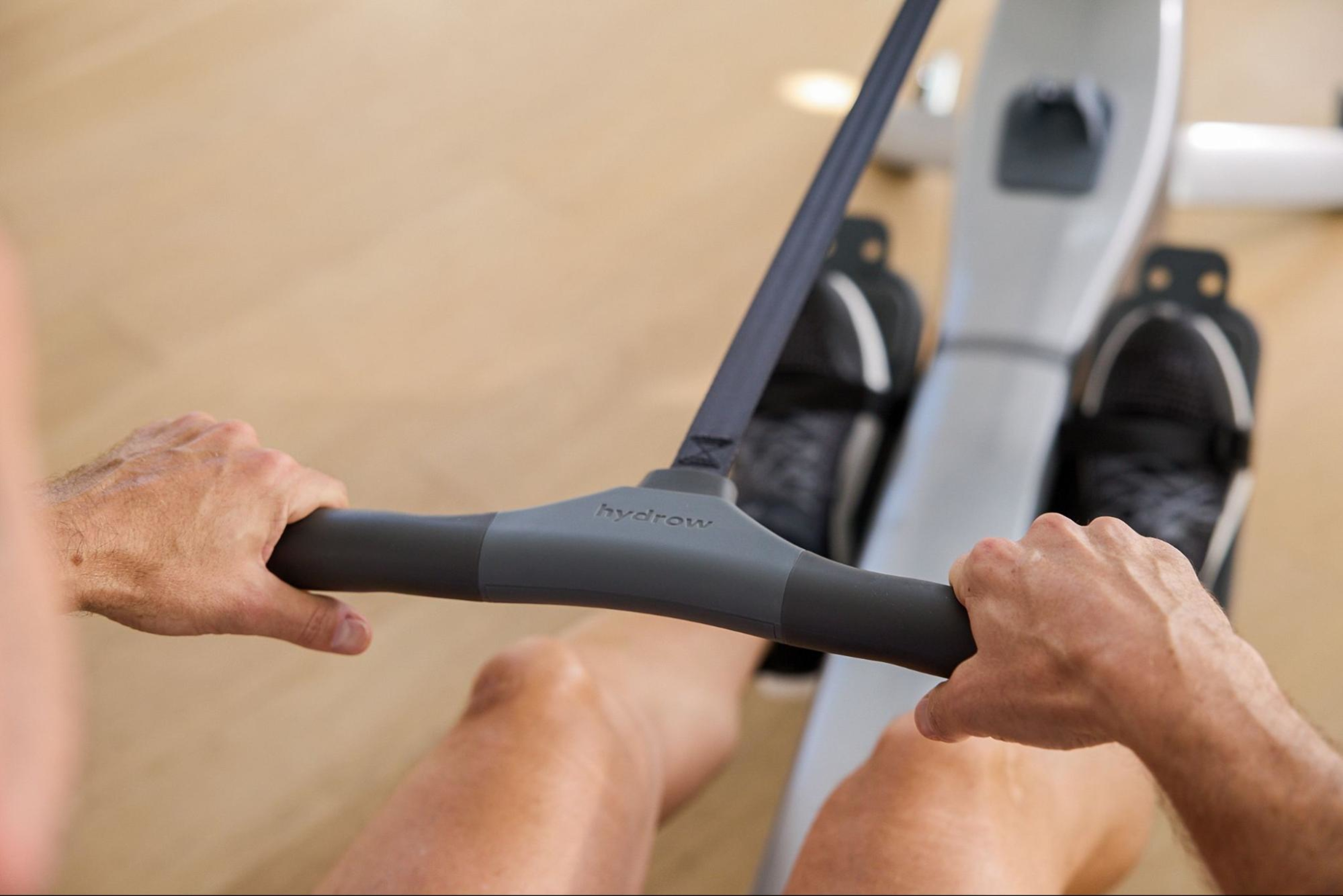 Man works out on a rowing machine.