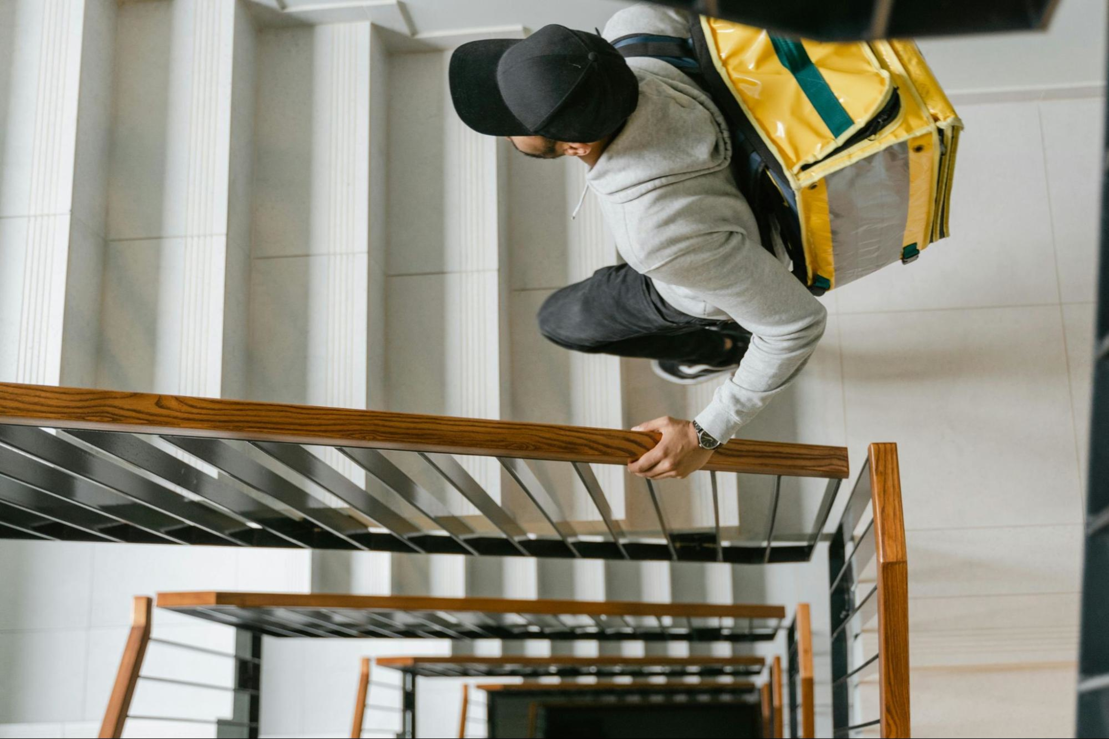 Man engages in physical activity by taking the stairs instead of the elevator.