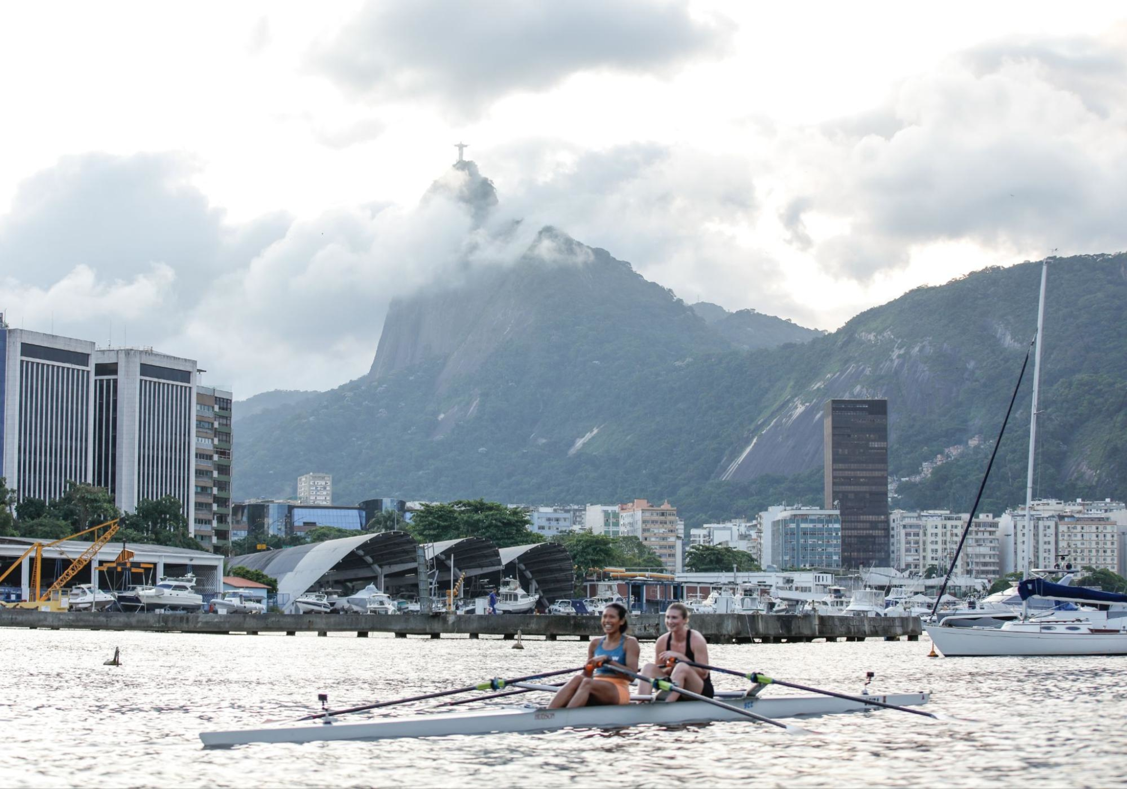 Hydrow Athletes lead a rowing workout in Brazil, one of Hydrow's destinations.