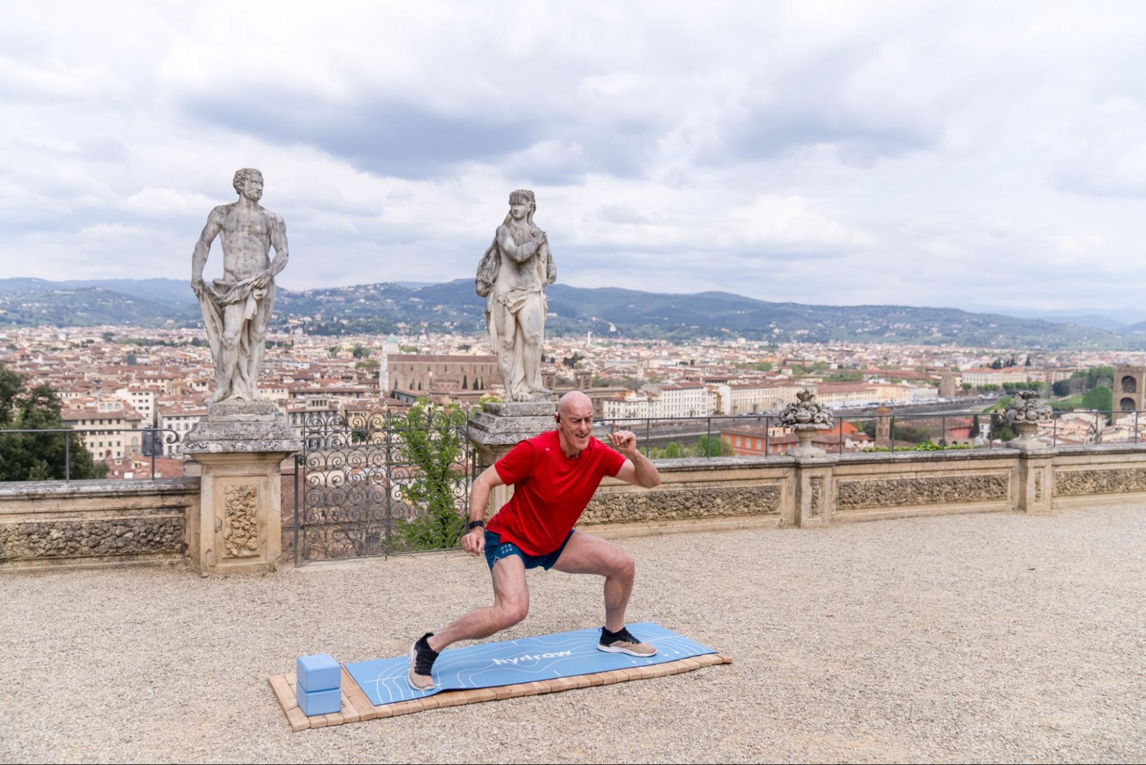 Hydrow Athlete leads a mobility workout in Italy, one of Hydrow's destinations.