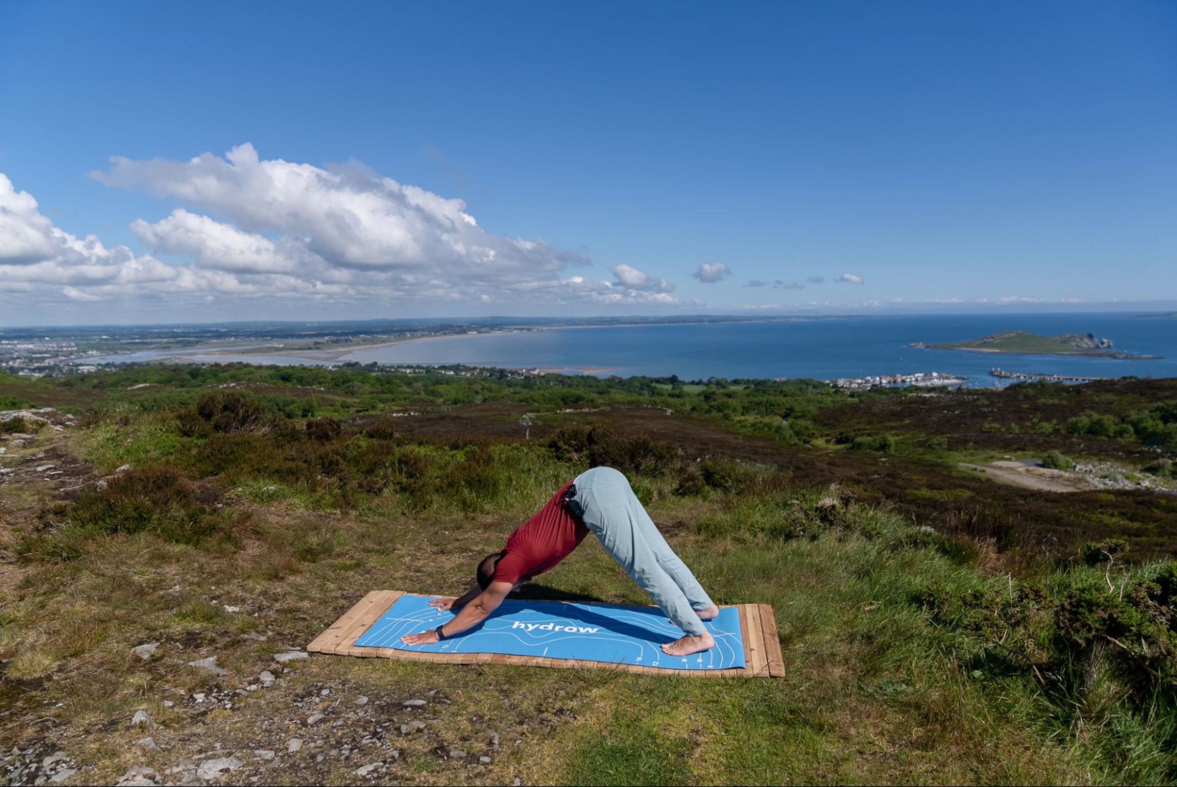 Hydrow Athlete leads a yoga workout in Ireland, one of Hydrow's destinations.