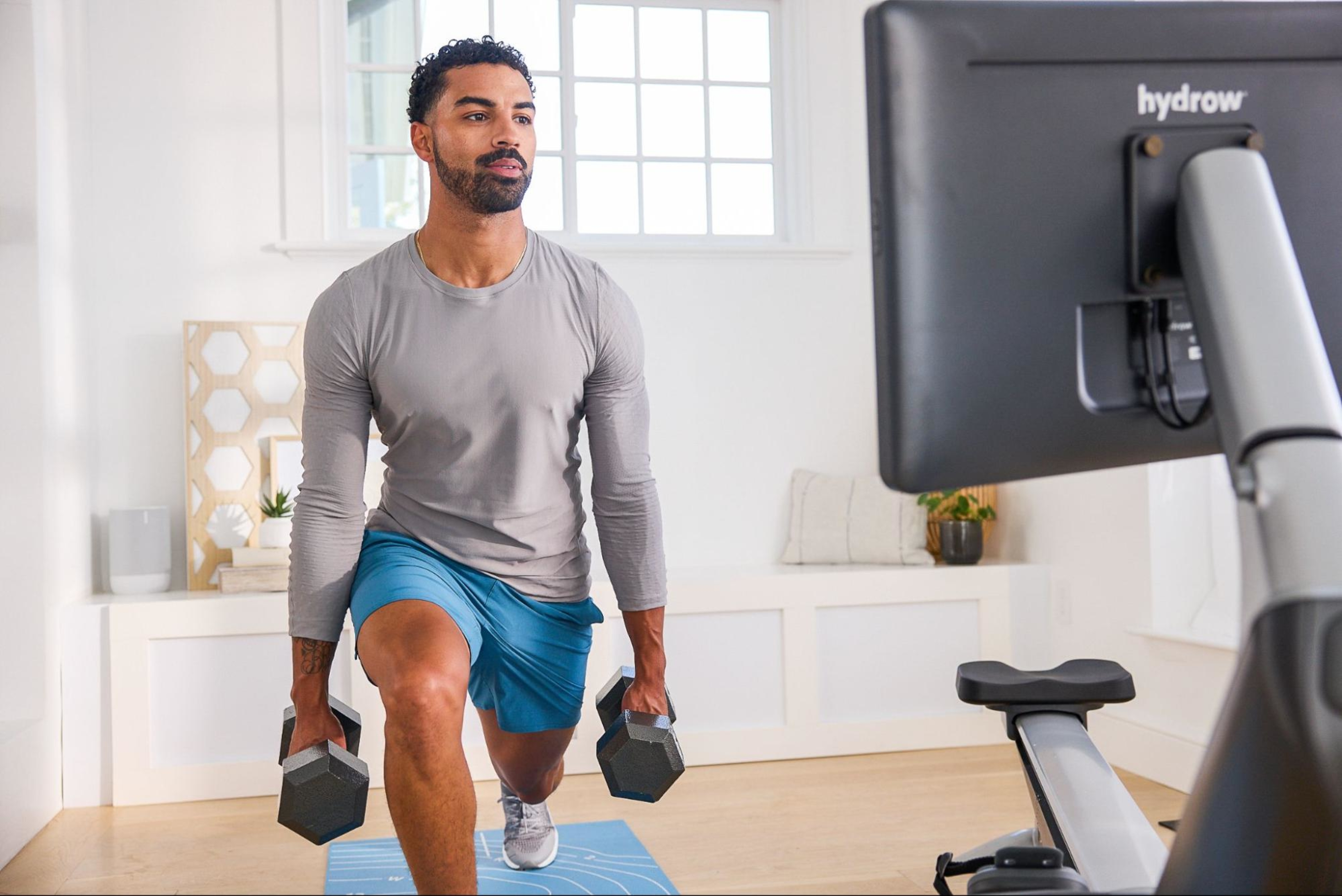 Man does a cardio and strength combo circuit, a great full-body circuit training workout for beginners.