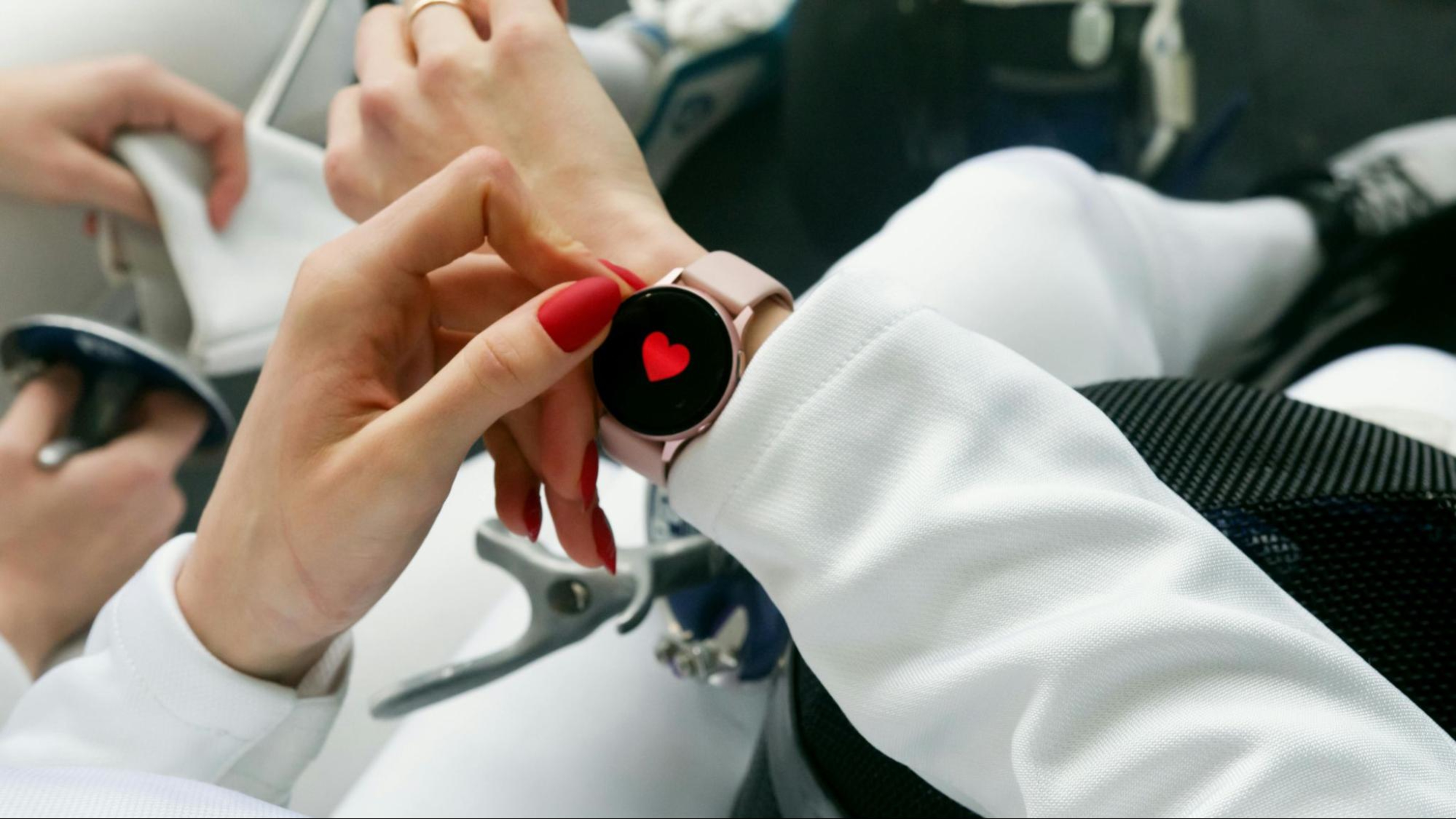 Woman checks her fitness wearable.