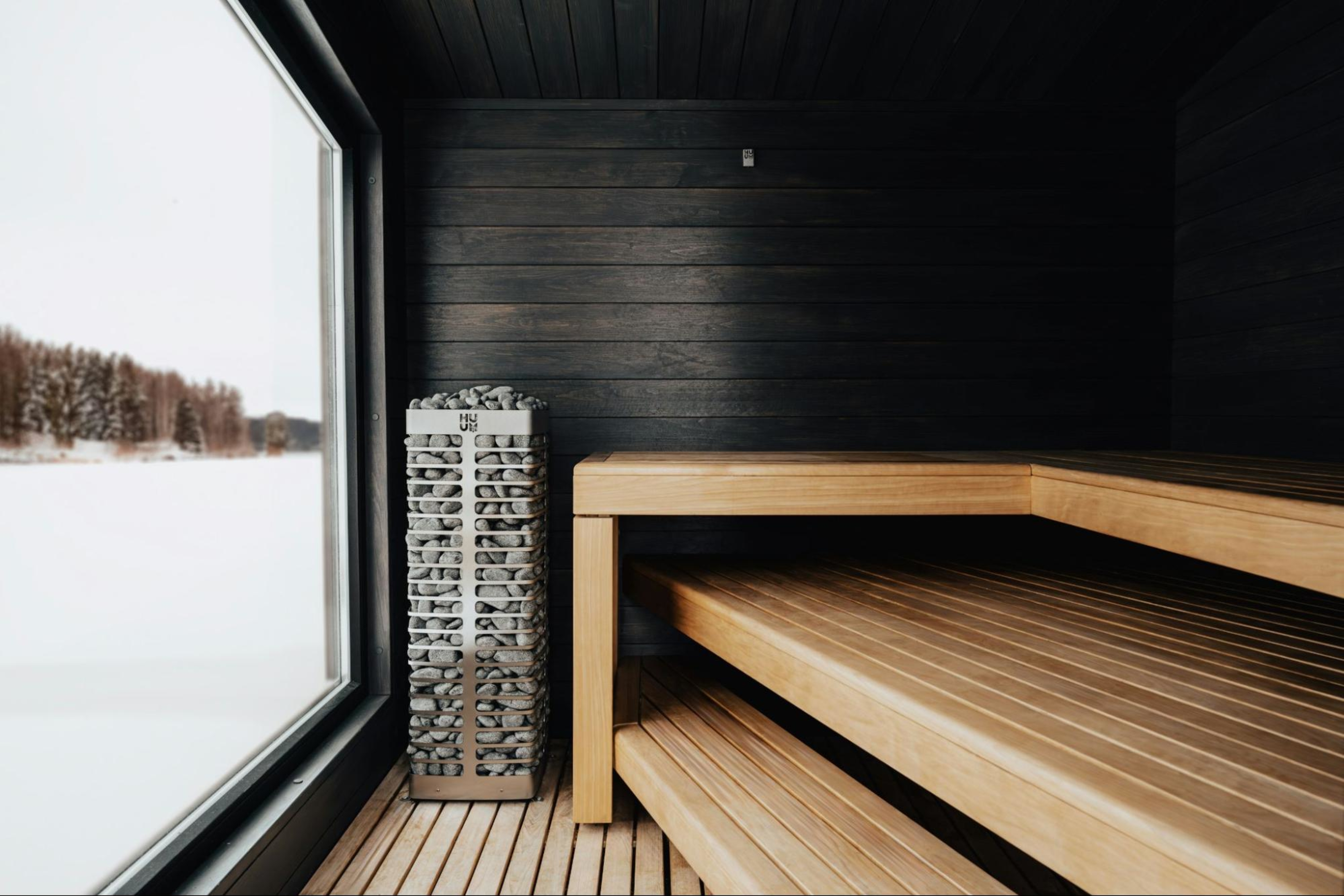Heat therapy in a sauna, an example of a 2025 fitness trend.
