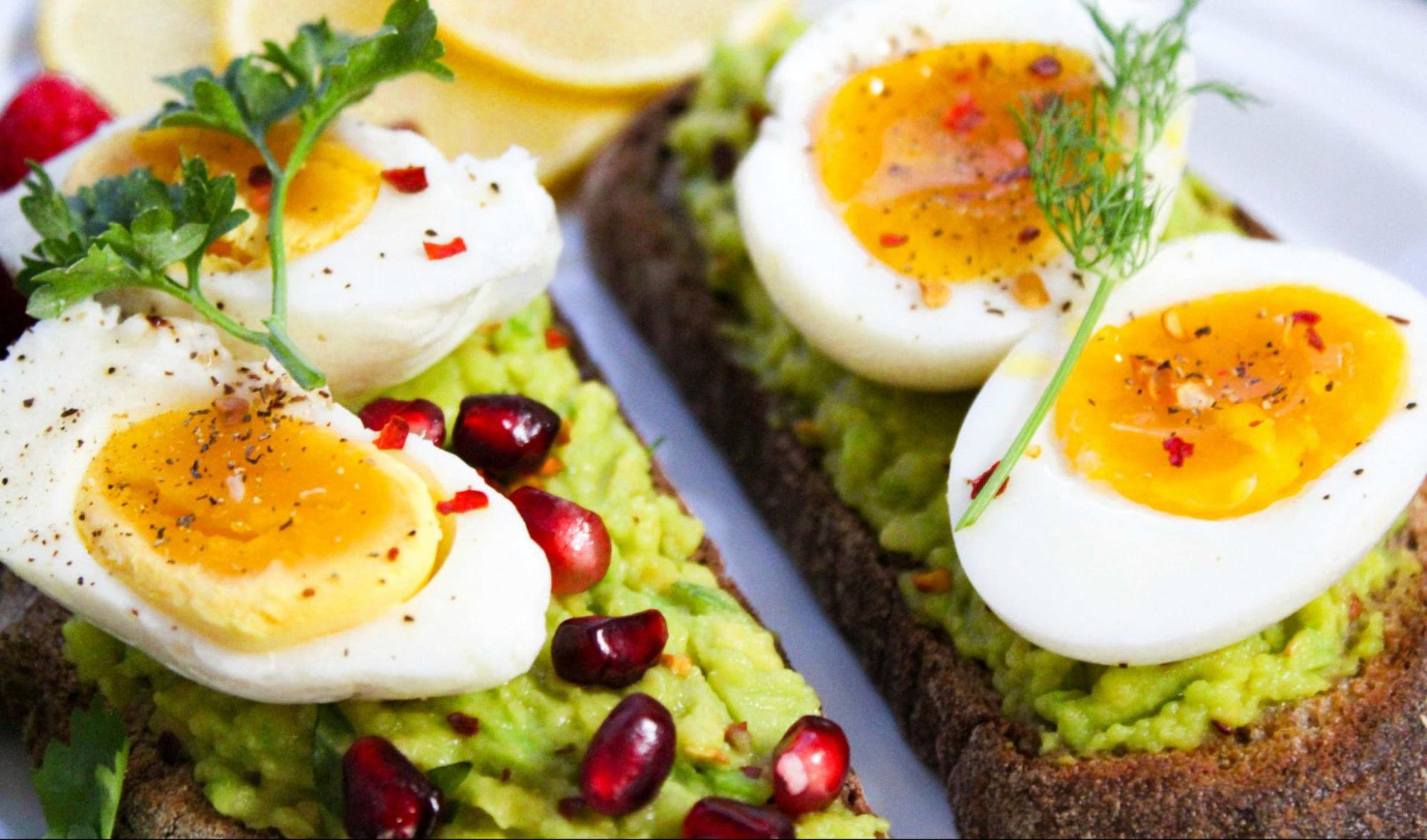 High-protein snack of boiled eggs and avocado toast.