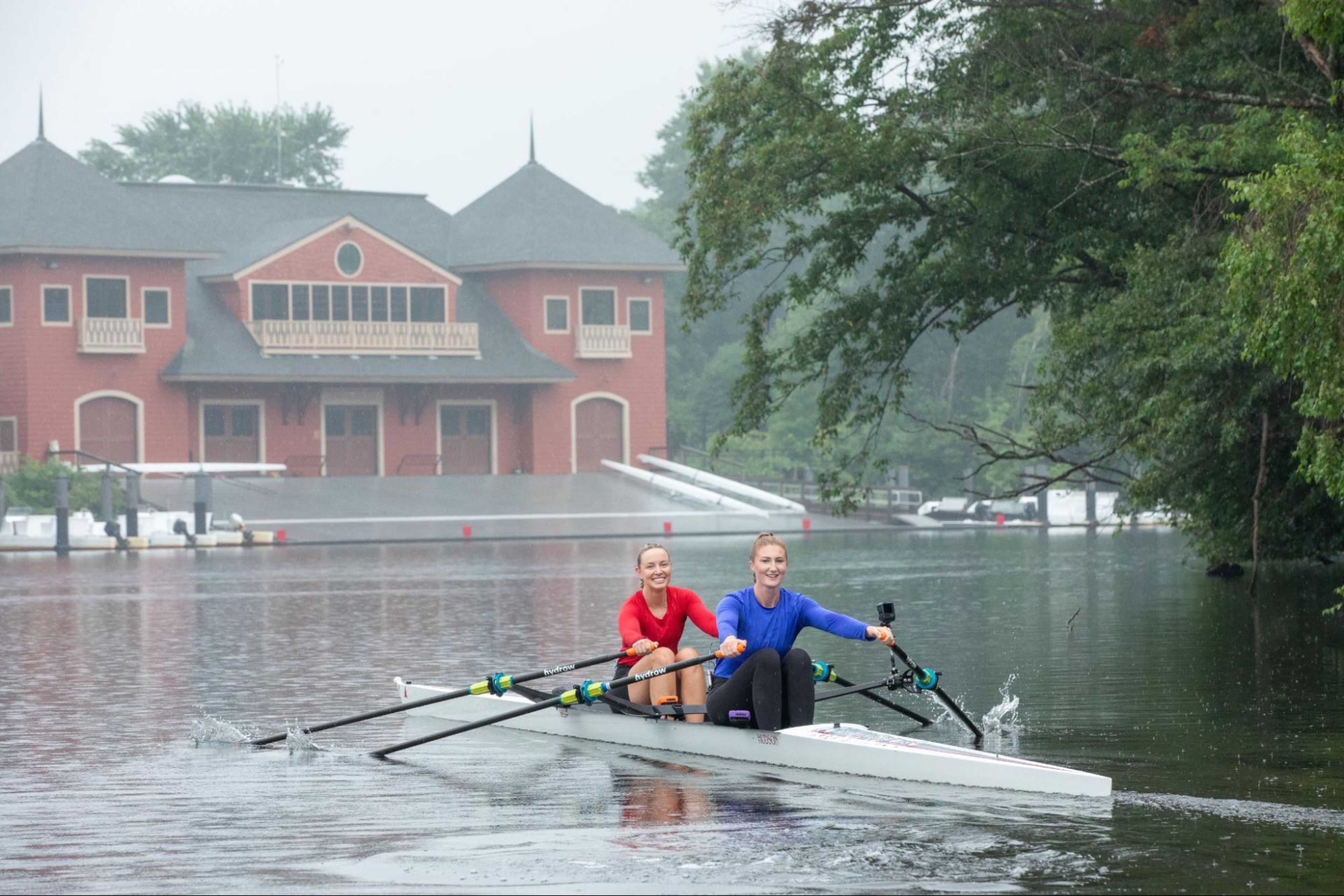 Two Hydrow Athletes lead a workout on the Charles River.