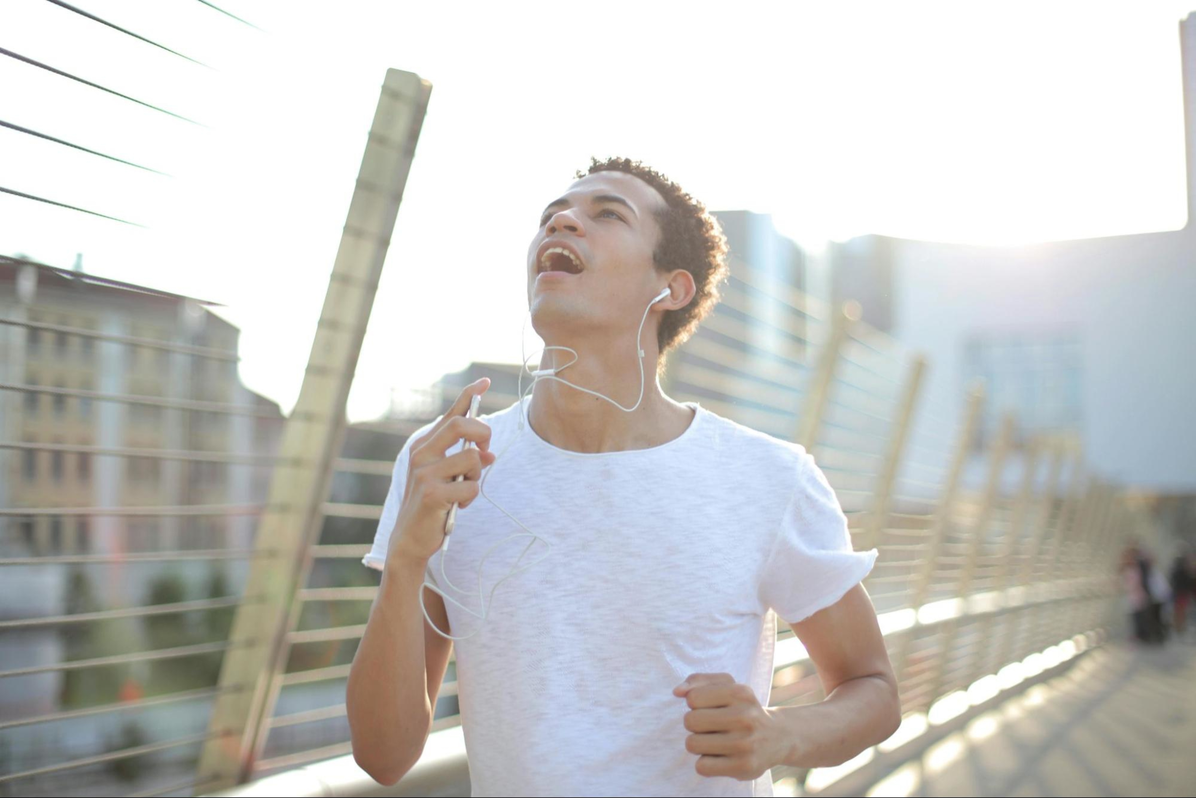 Man does a running workout, one of the best types of cardio exercise.