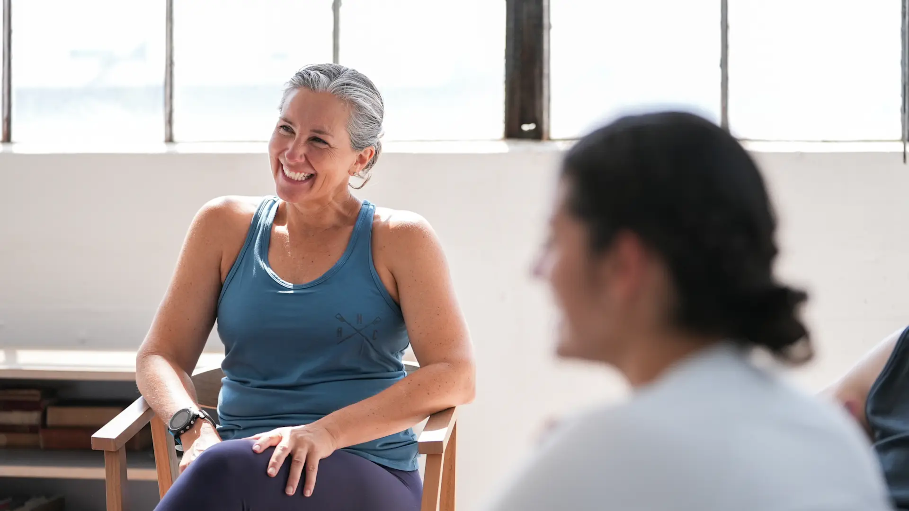 Megan Hanewald, Hydrow's lead personal coach, does a coaching session with a Hydrow member.