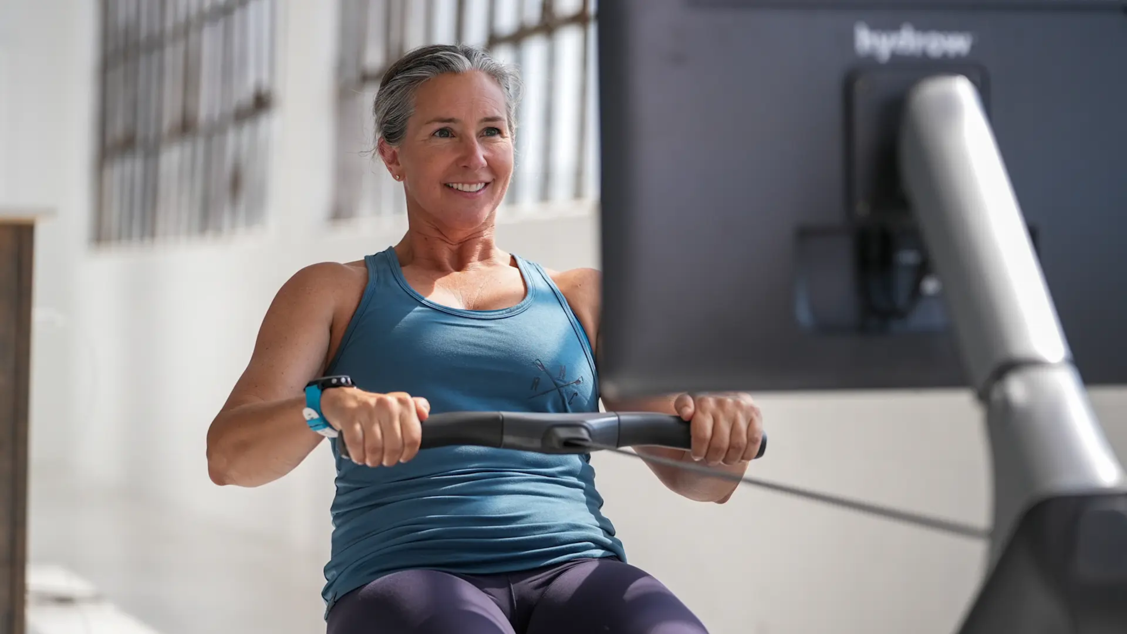 Megan Hanewald, Hydrow's lead personal coach, works out on a Hydrow rowing machine.