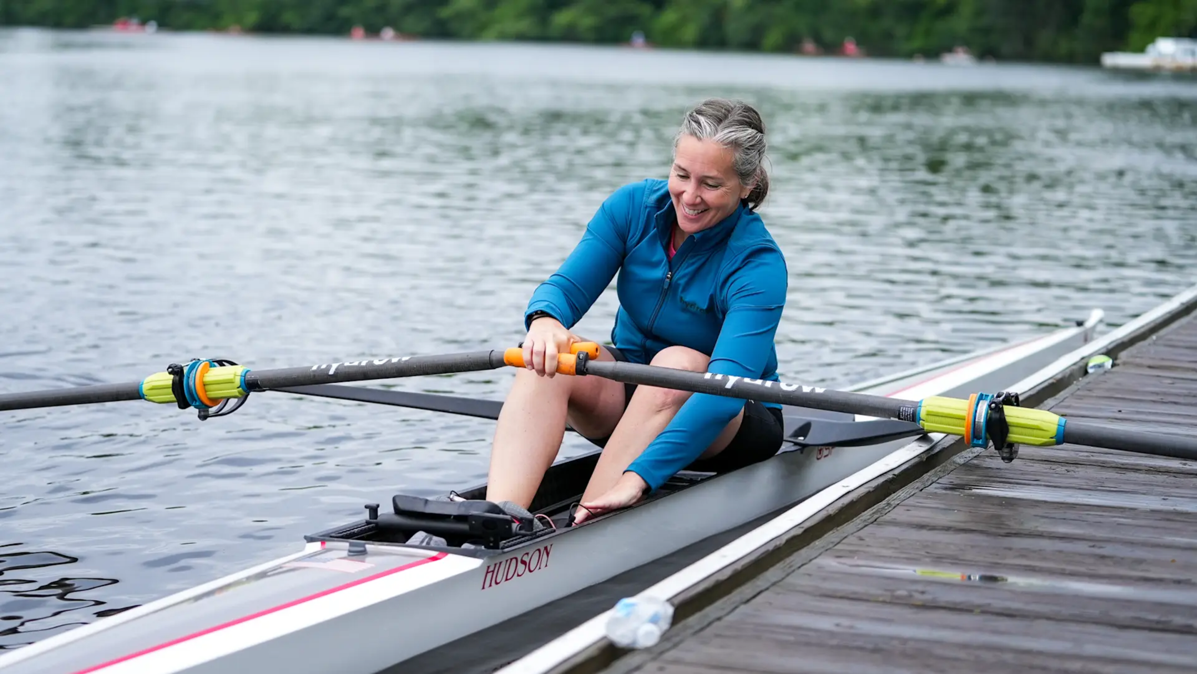 Hydrow's lead personal coach Megan Hanewald prepares to row on the water.