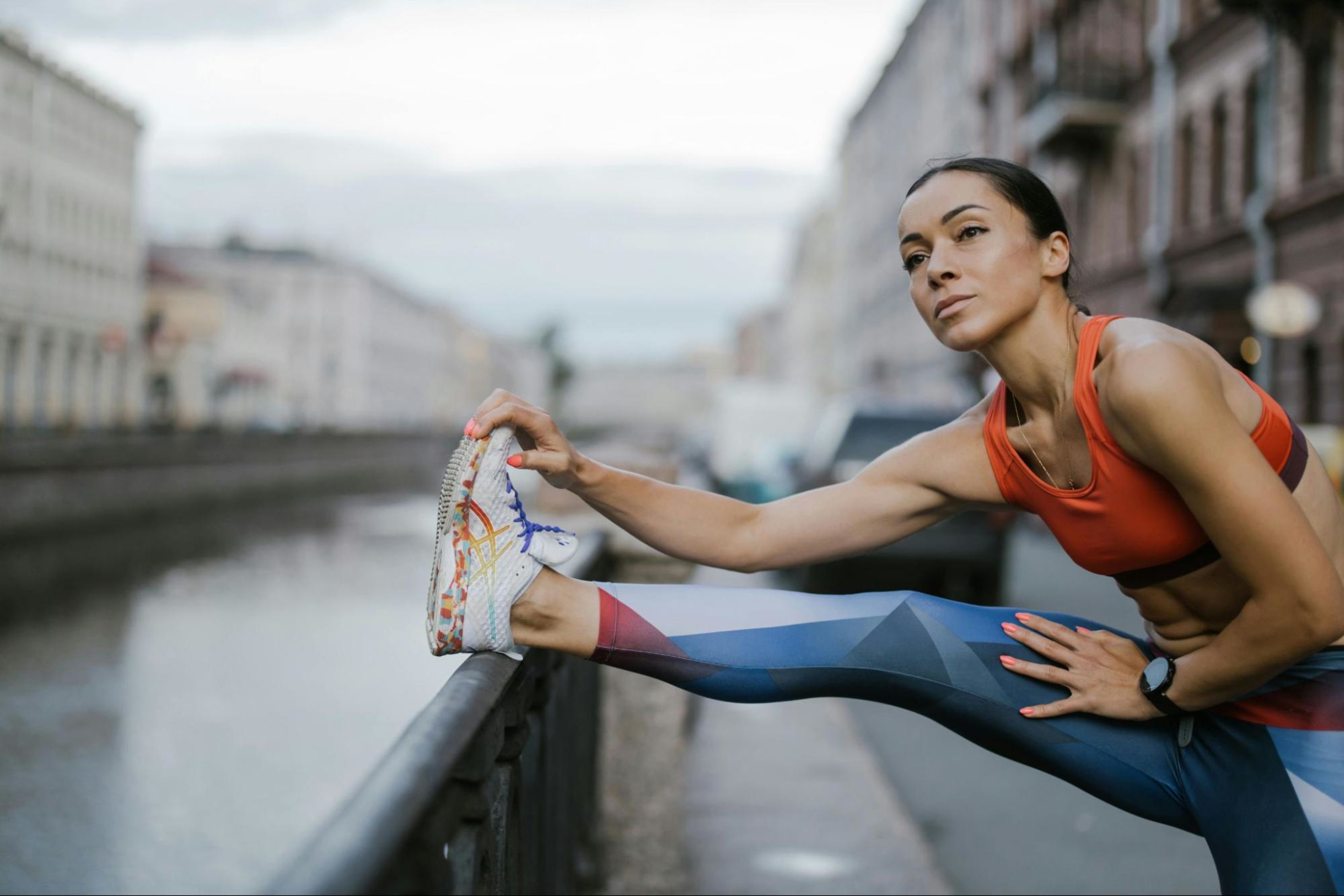 Woman stretches before going on a run.