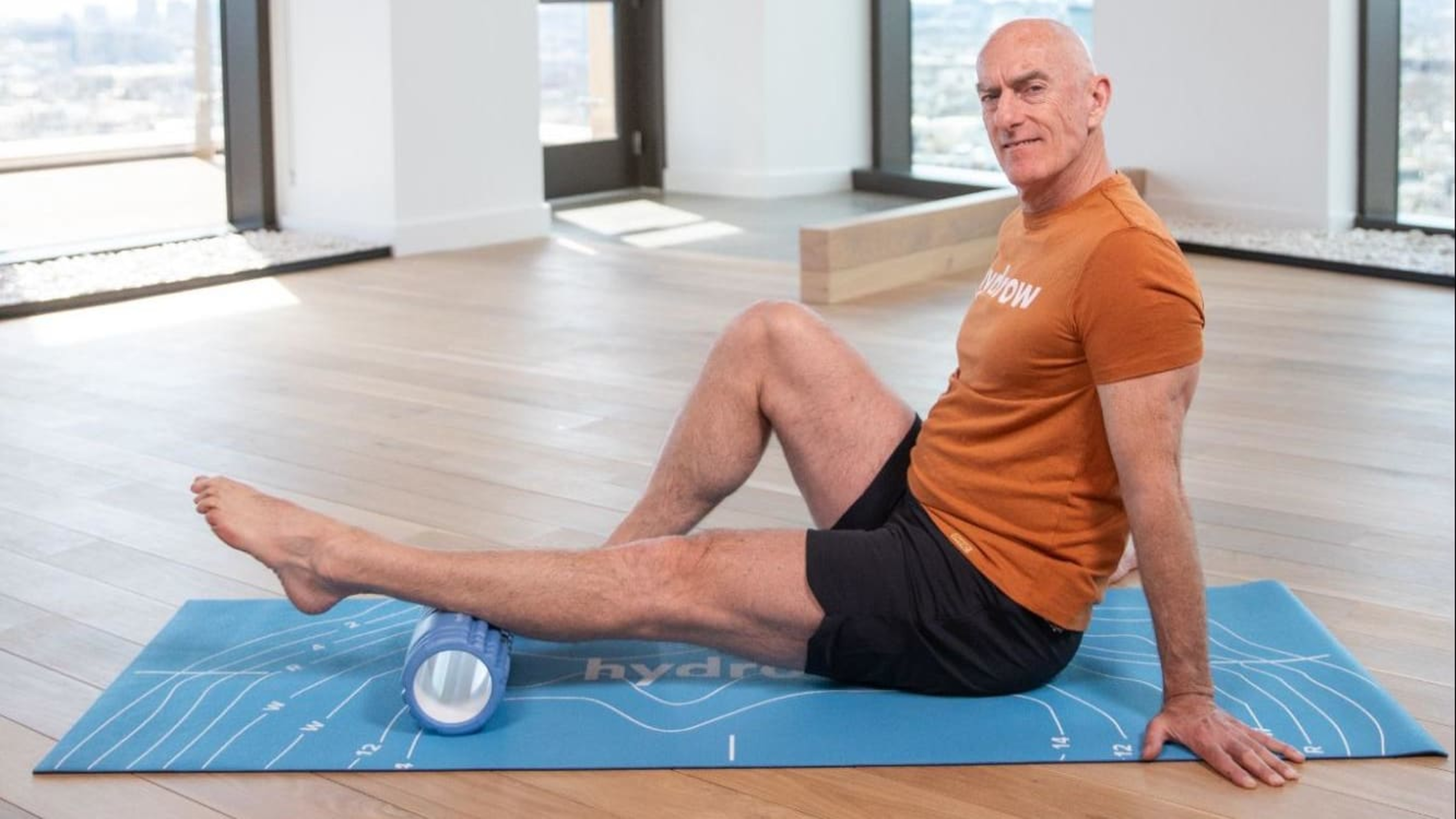 Hydrow Athlete Pete demonstrates when to use a foam roller to ease calf soreness.