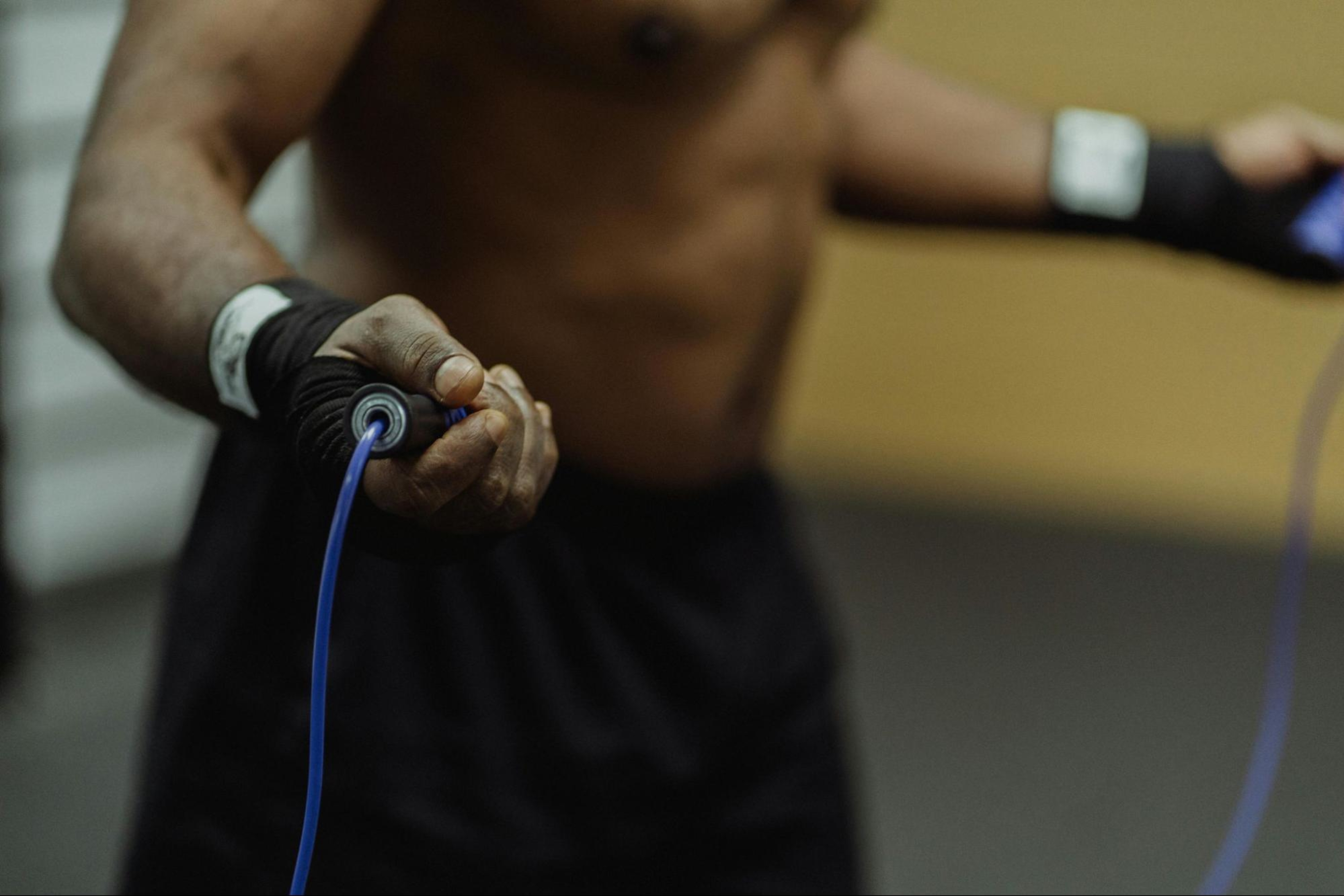 Man learns tips for gaining arm muscle by doing a jump rope exercise.