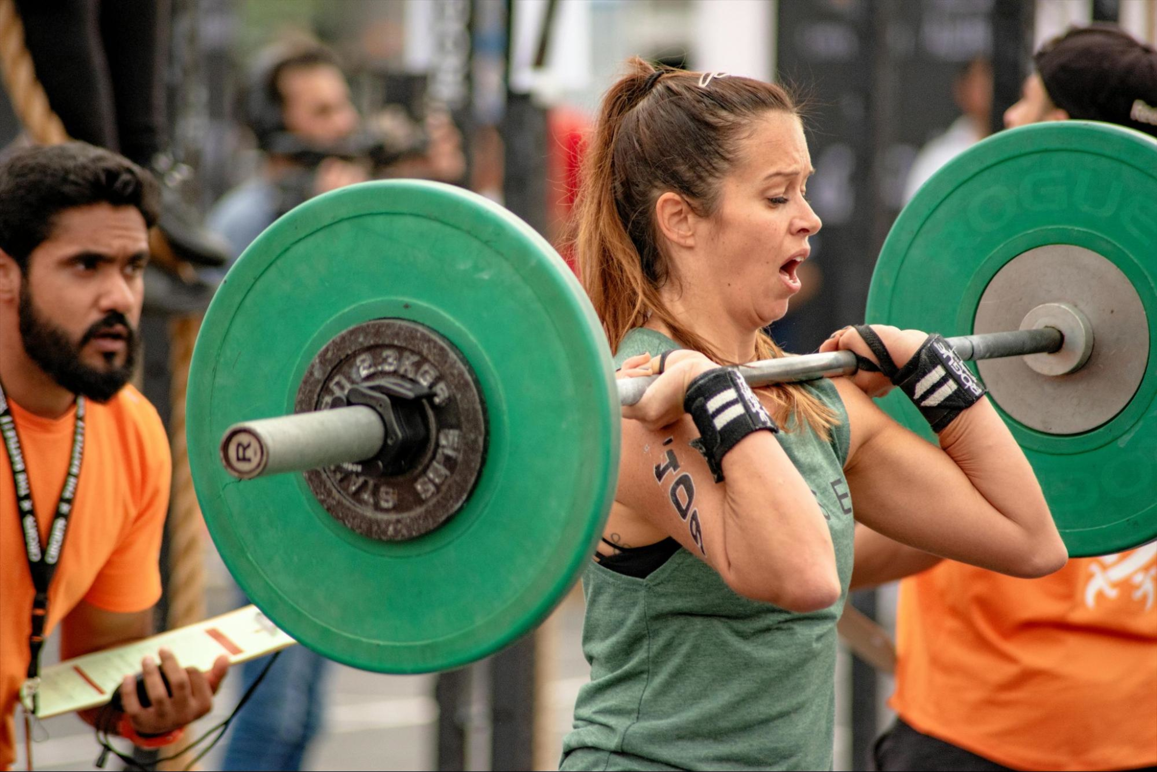 Woman breathes while lifting weights in a competition.