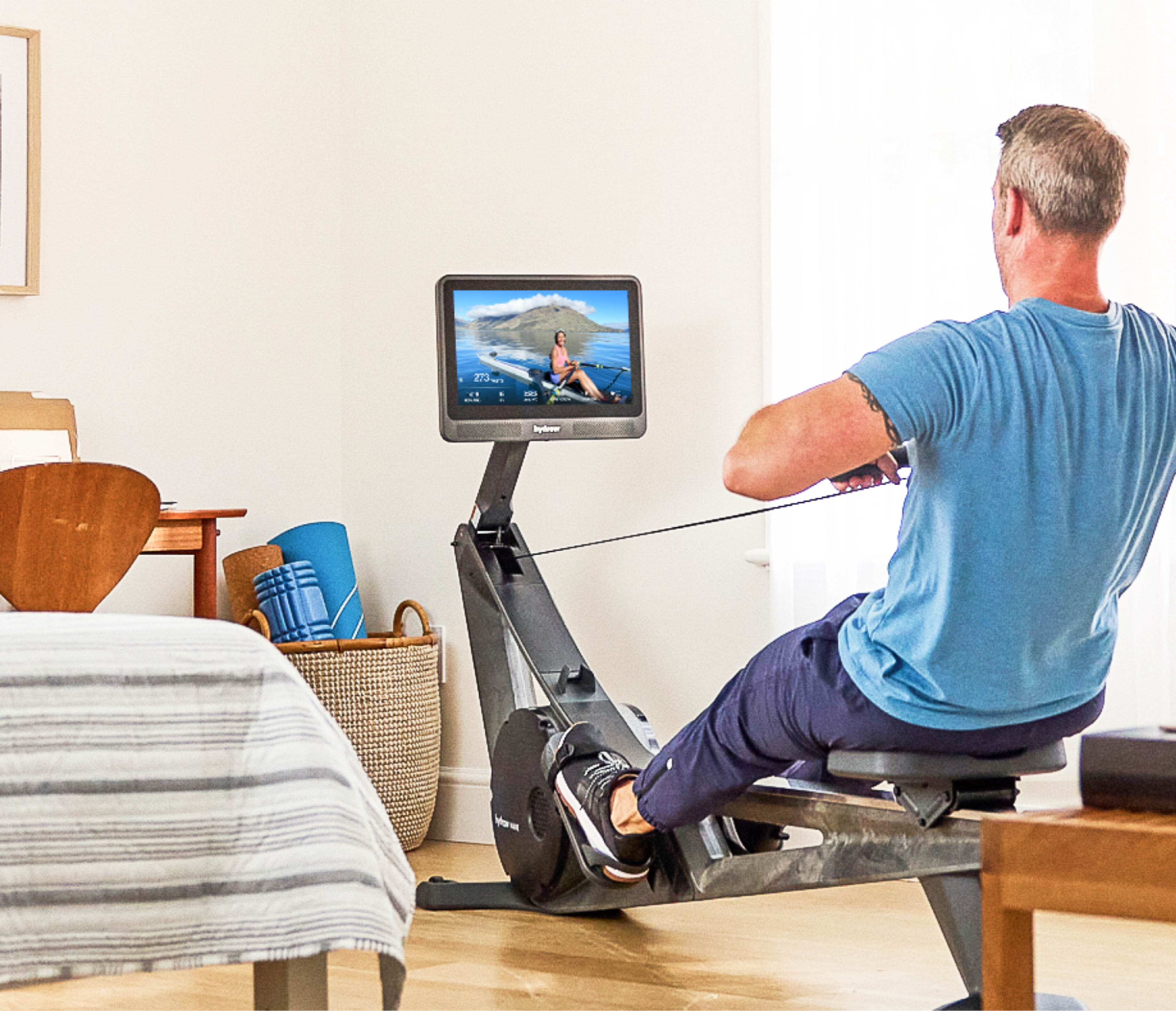 Man works out on a rowing machine to lower his blood pressure.