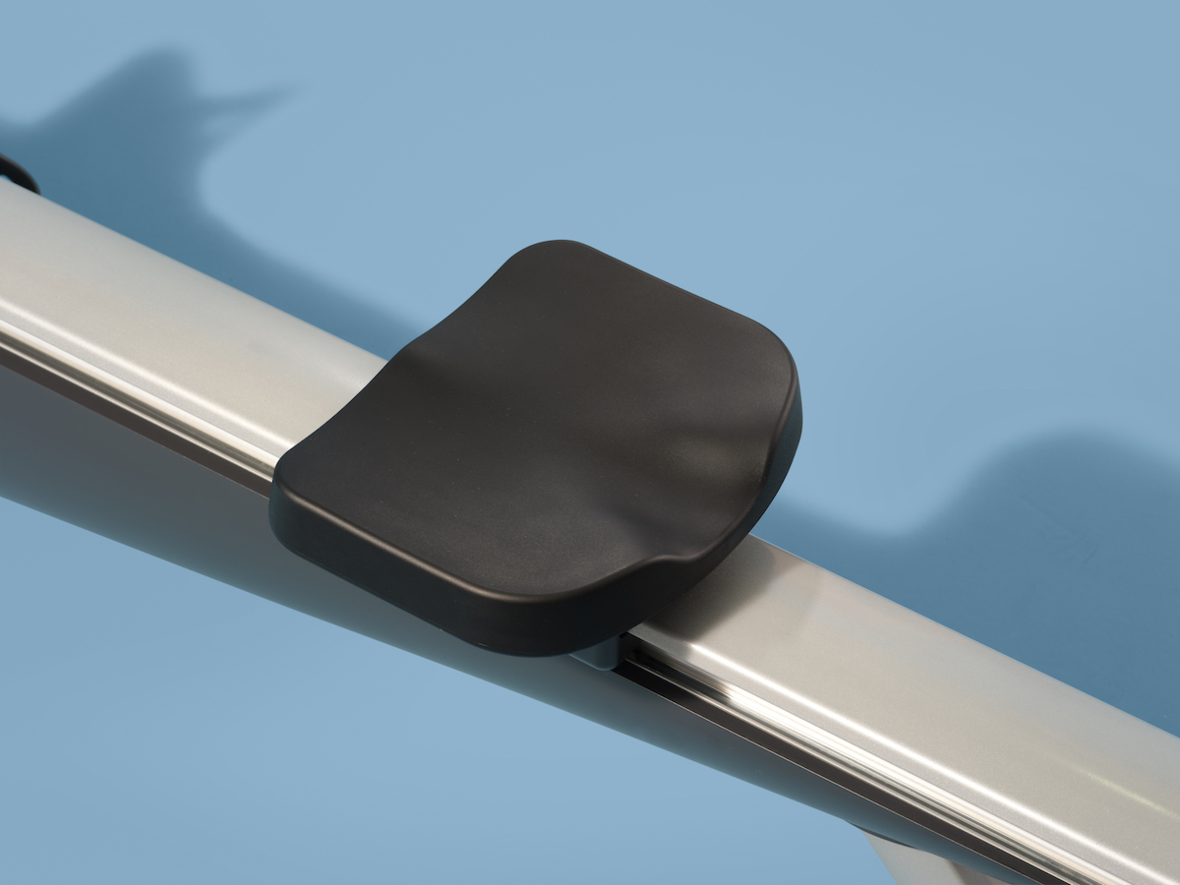 A close-up shot of the seat on a Hydrow Arc rowing machine.