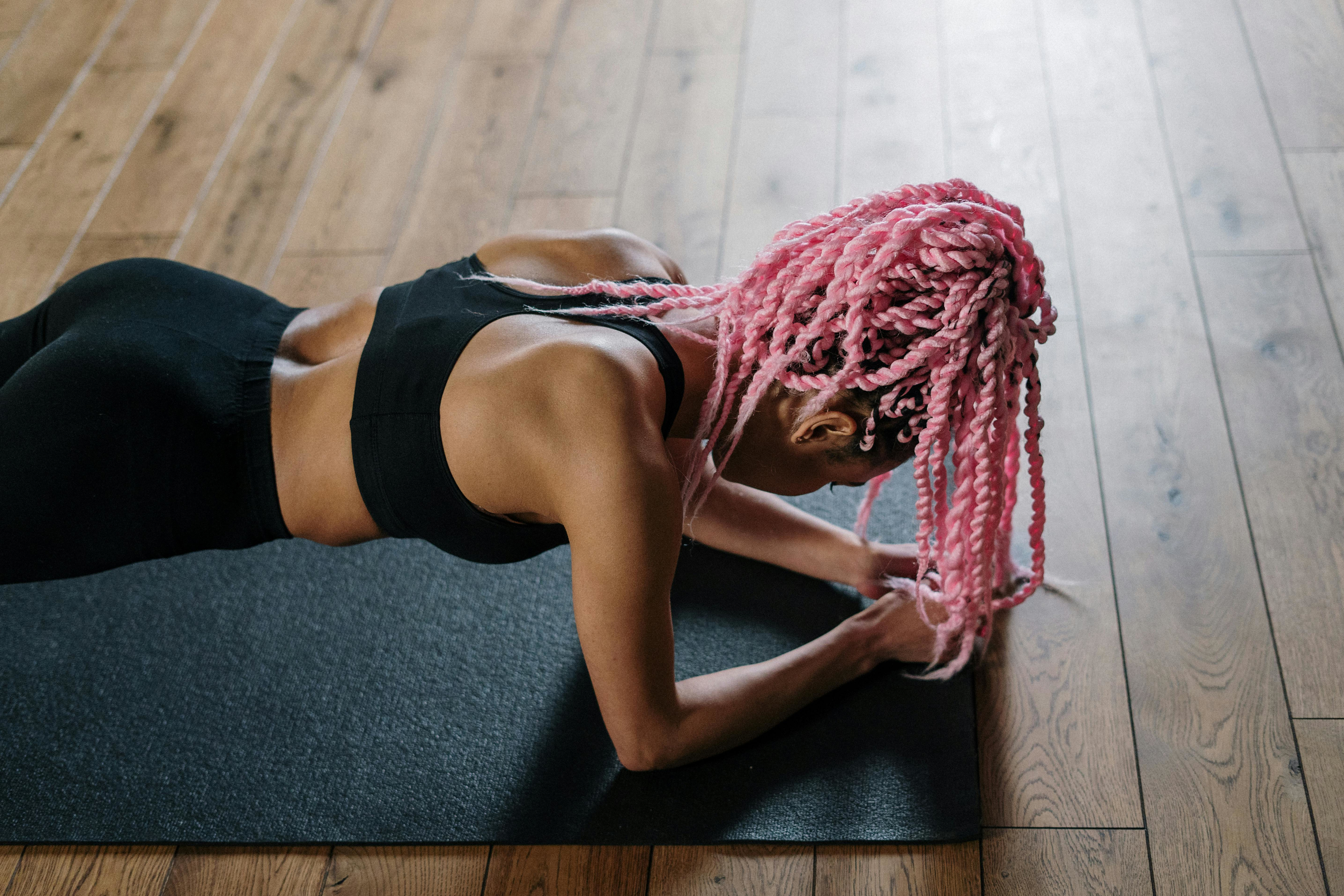 Woman does a plank, a popular core exercise.