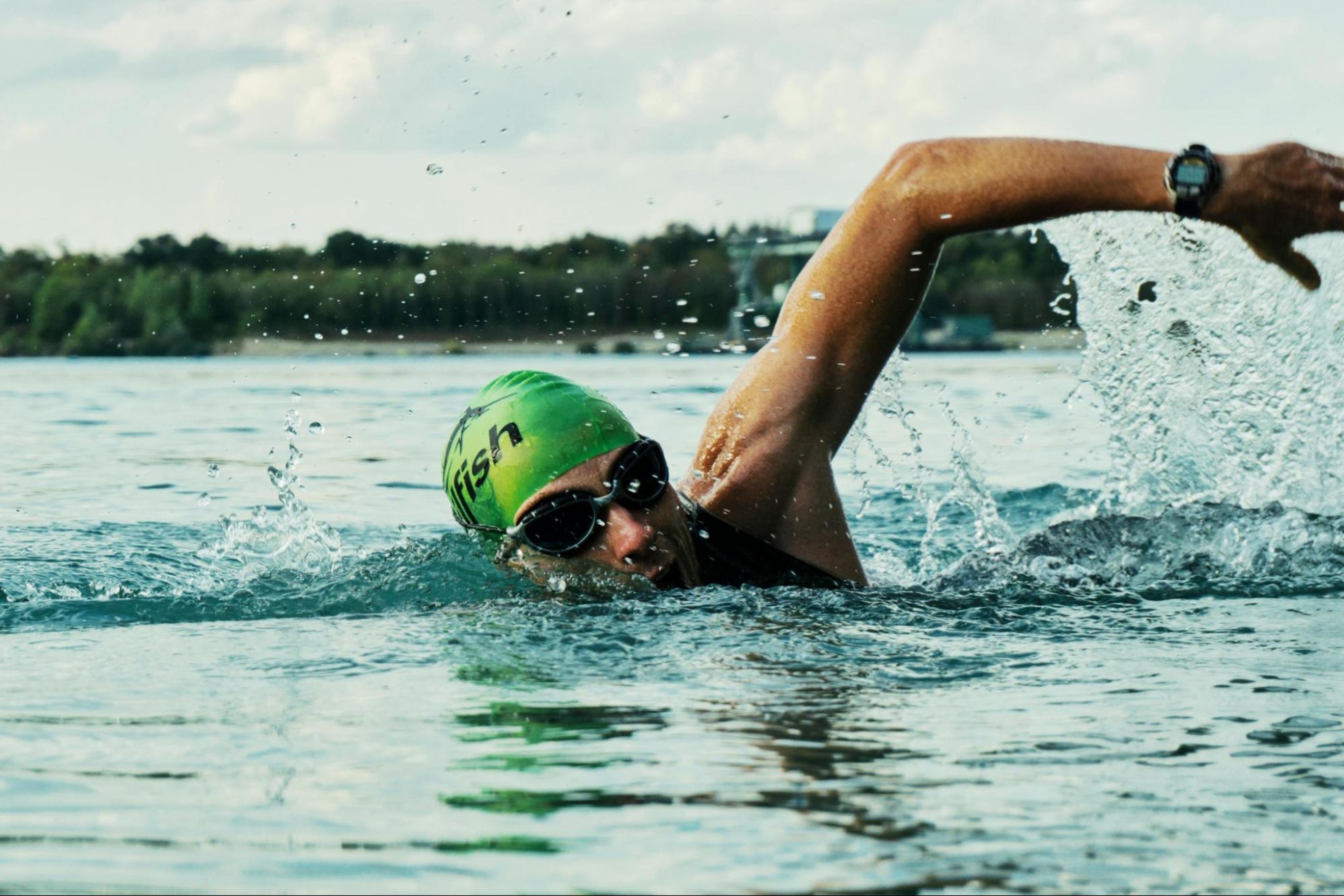 Man does a swimming workout after doing strength training for swimming.