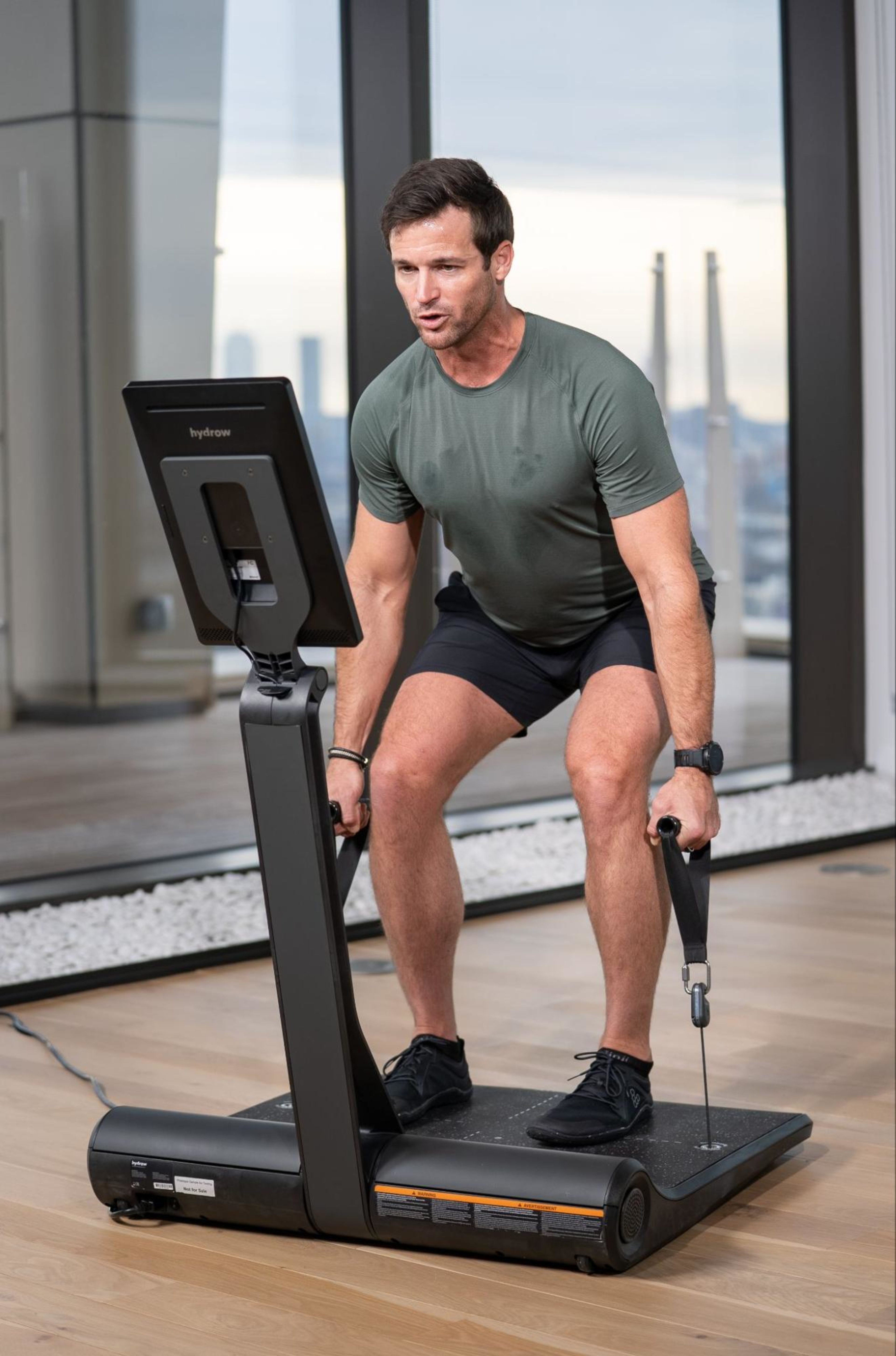 Hydrow Athlete Lance Parker leads a strength workout on LYQUID.