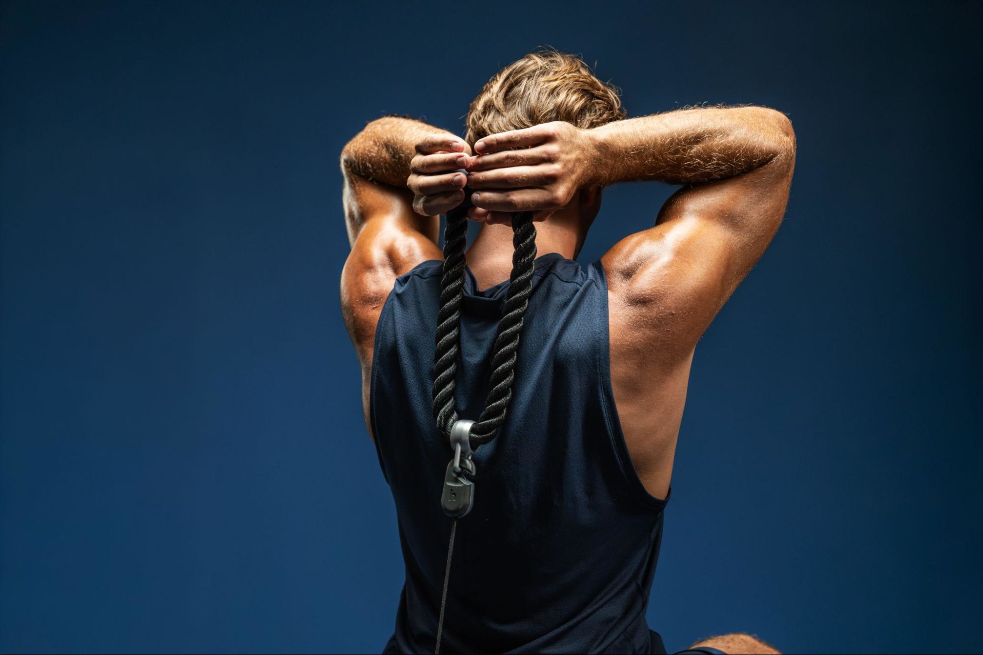 A man does a workout on a LYQUID strength platform.