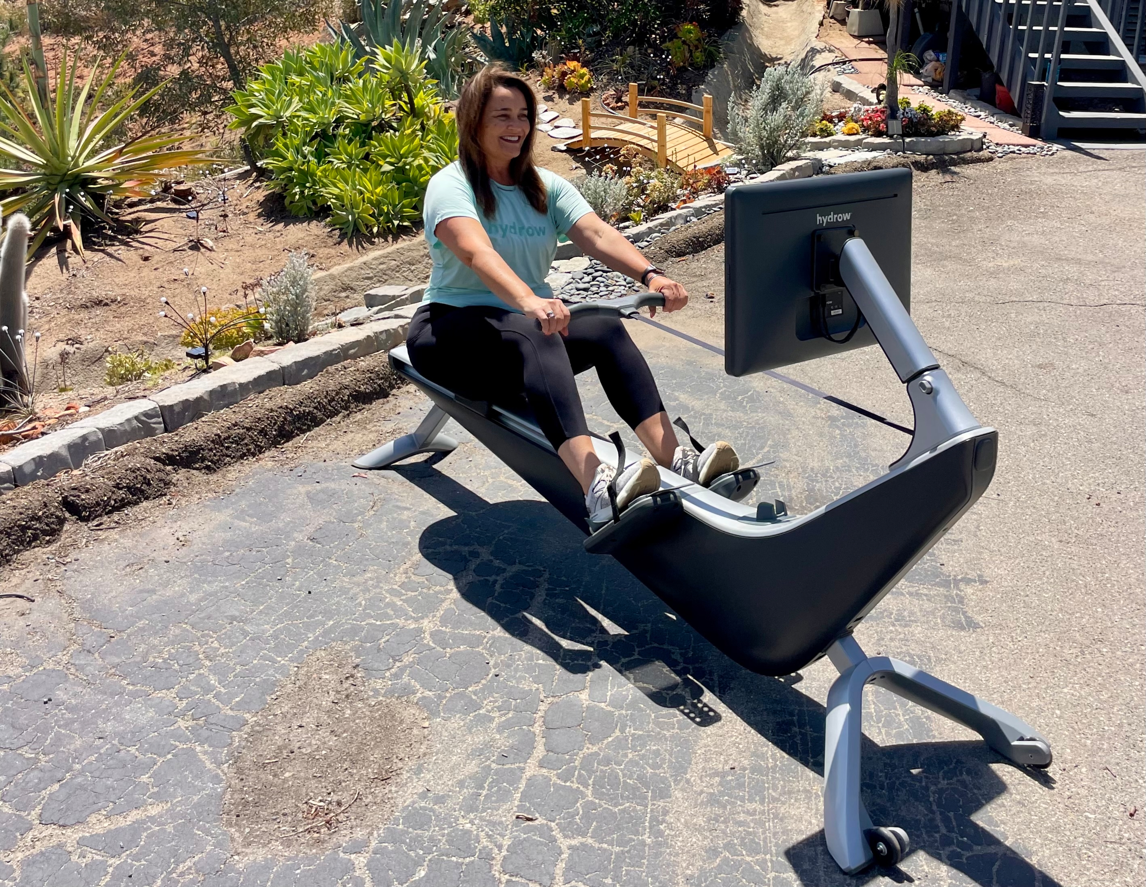 Hydrow Member Angela Romei works out on her Hydrow rowing machine.
