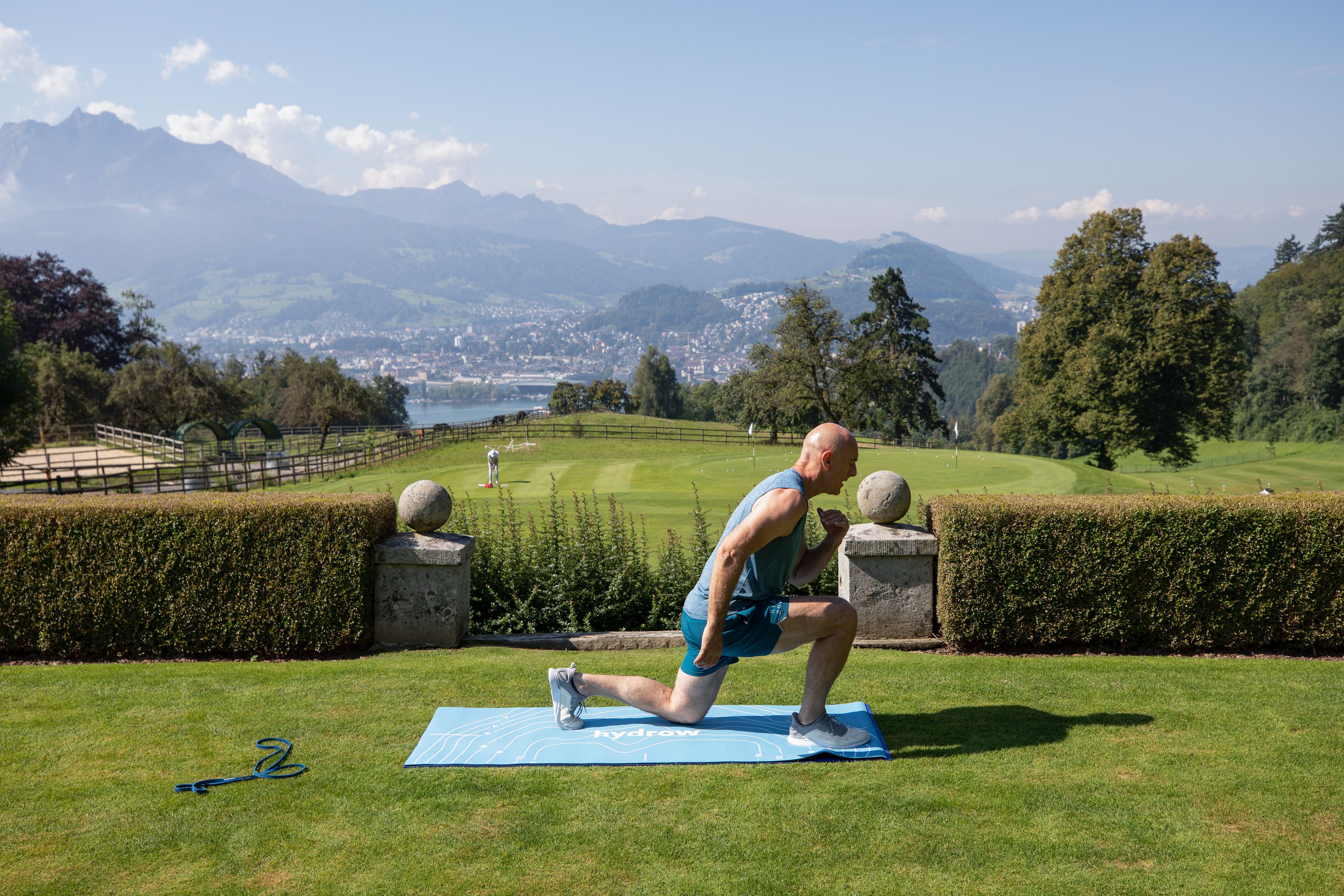 Hydrow Athlete suggests workout plans and exercises on a yoga mat.