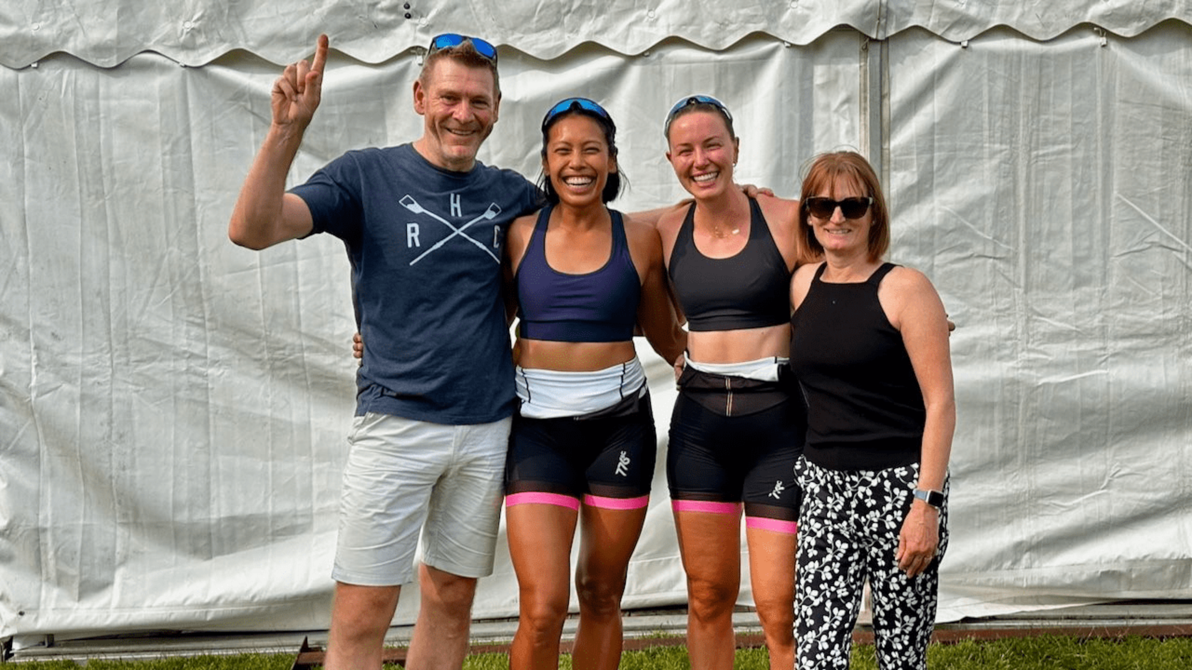 Hydrow Member Matt Peachey stands with Hydrow Athletes Aisyah and Mac.