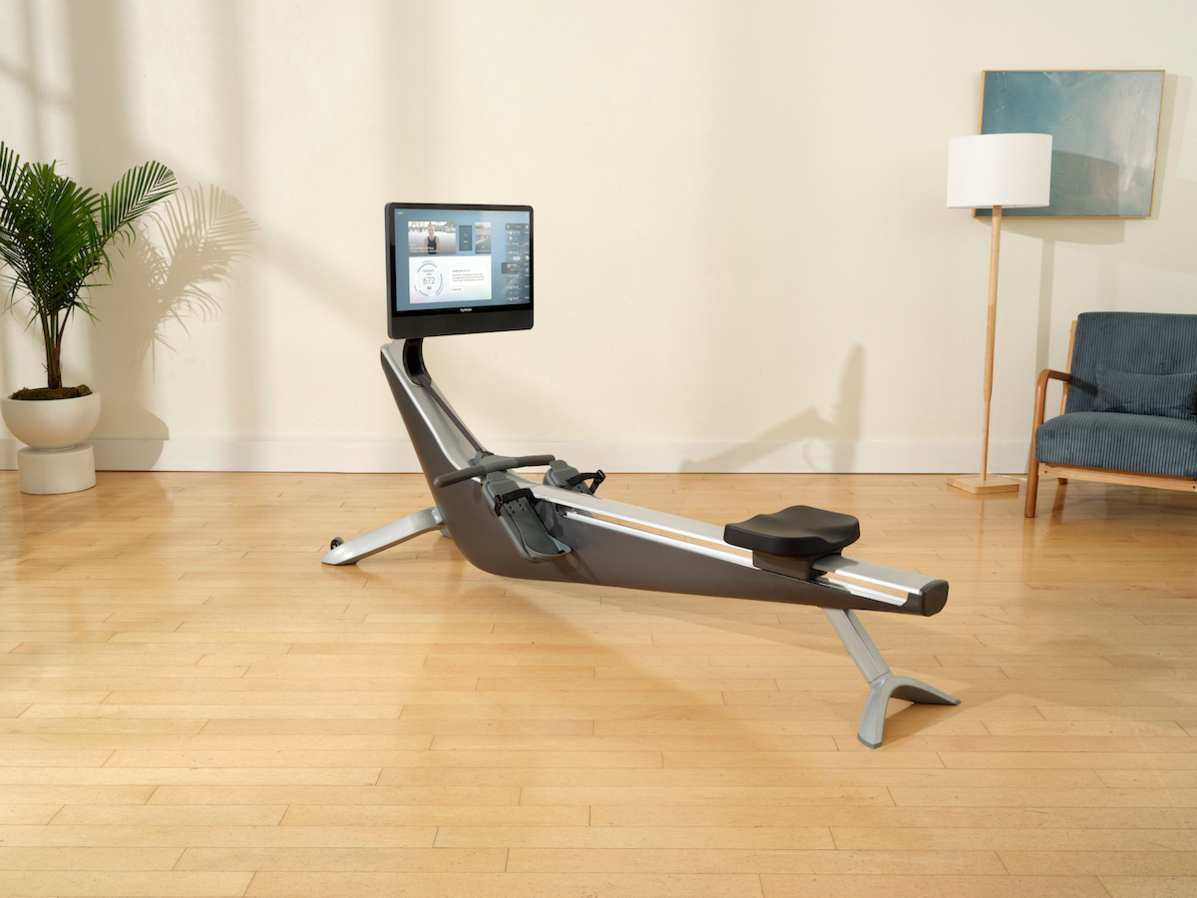 A Hydrow Arc rowing machine in a living room.