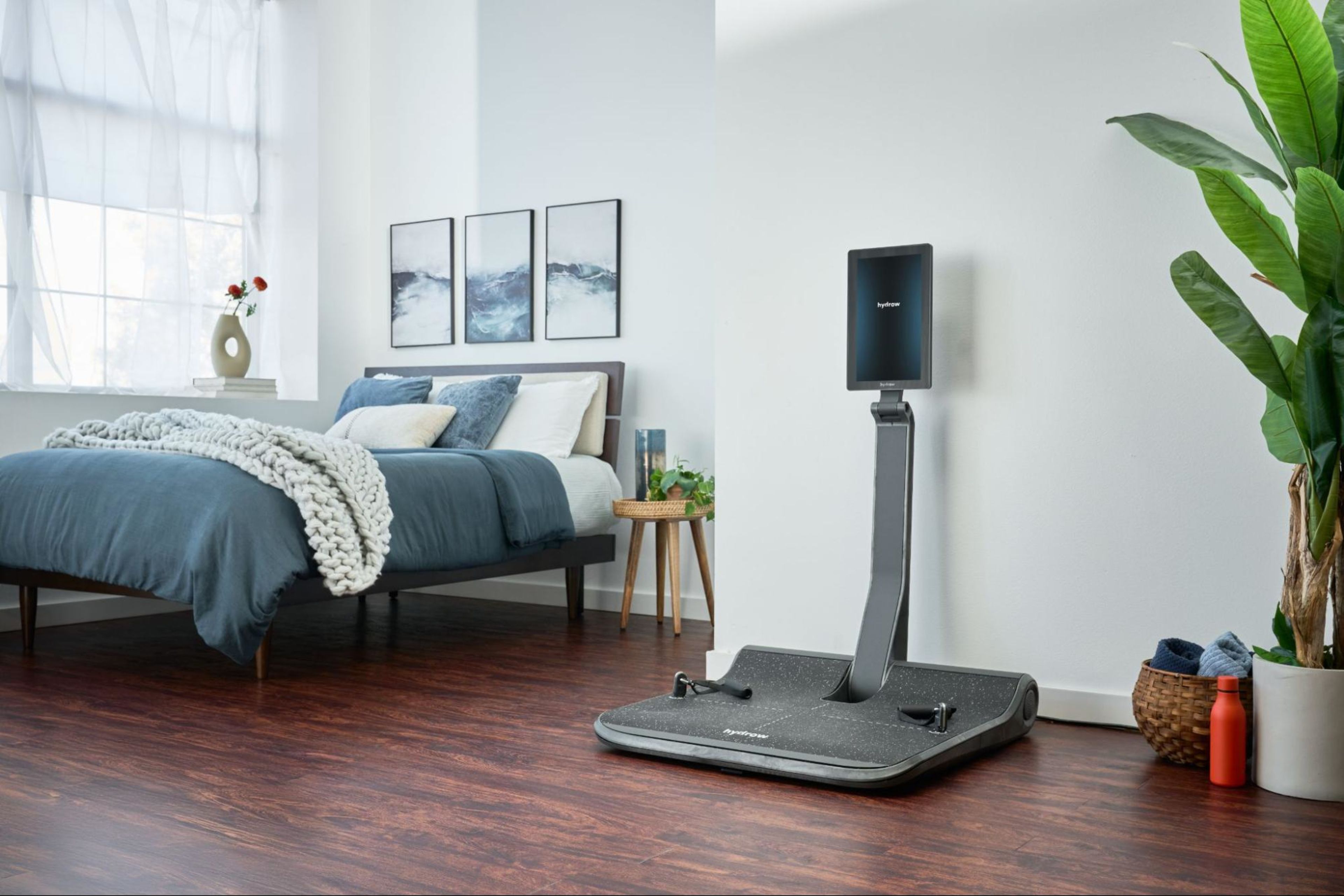 A LYQUID strength machine in a bedroom.