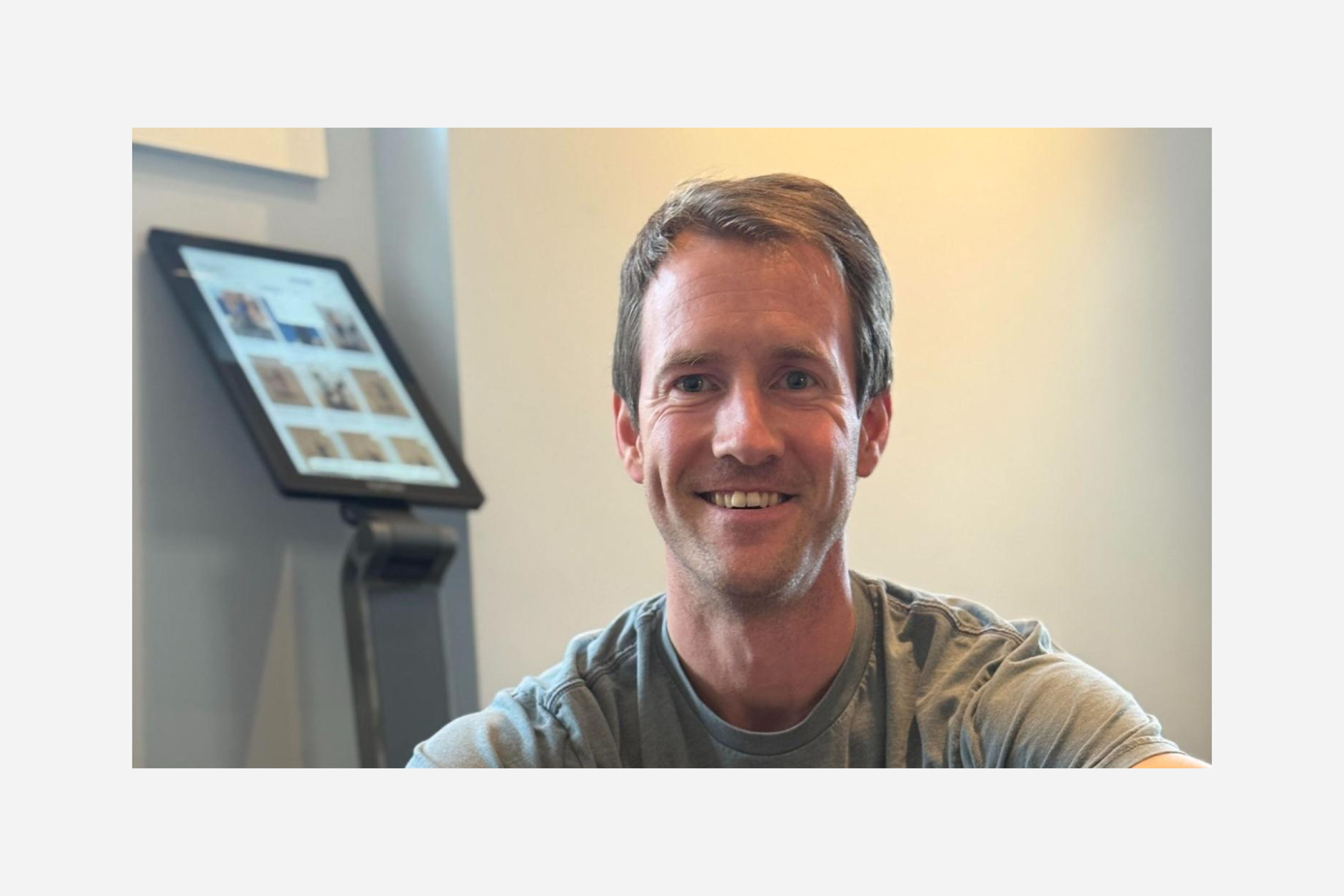 Hydrow Member Pete Abernethy sits with his LYQUID strength machine.