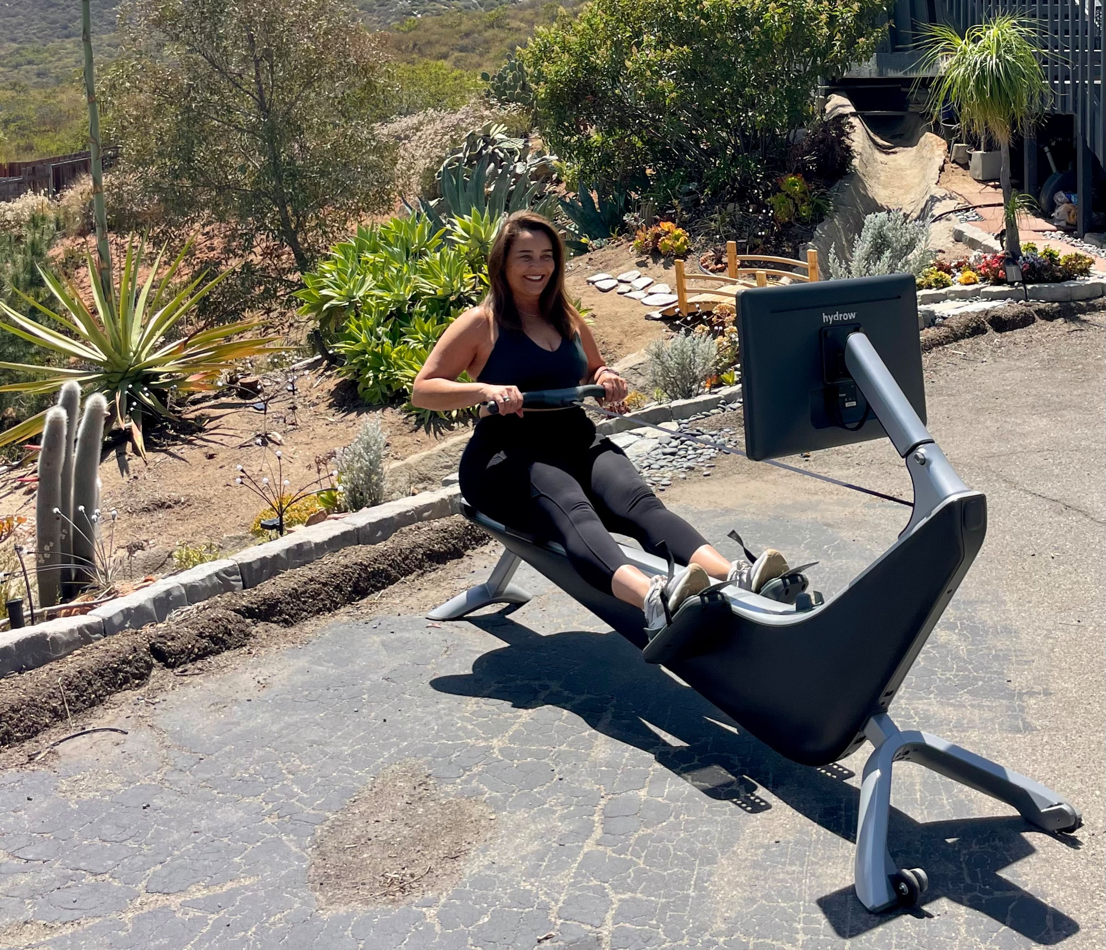 Hydrow Member Angela Romei works out on her Hydrow rowing machine.