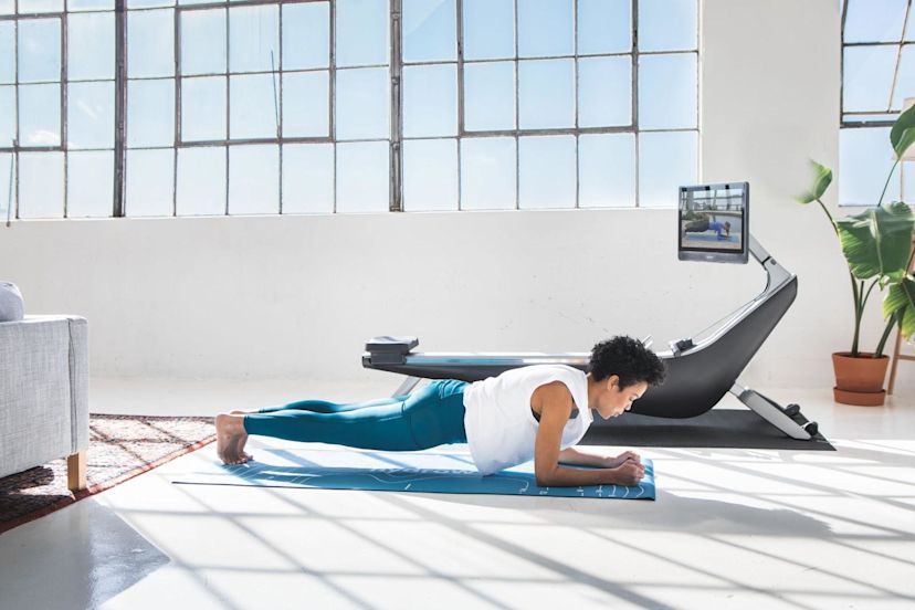 Woman does a plank after starting exercise when out of shape.