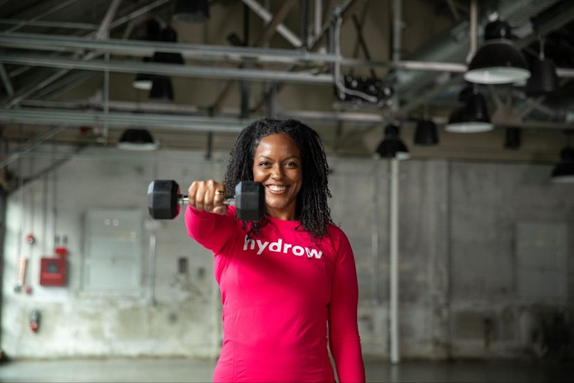 Hydrow Athlete Rina demonstrates how often to increase your weight when lifting with a dumbbell.