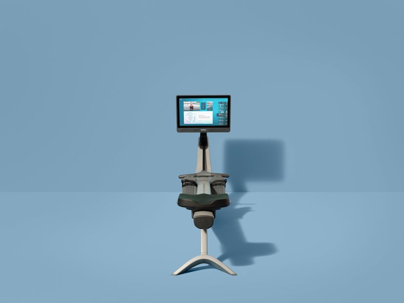 A Hydrow Arc rowing machine against a blue background.
