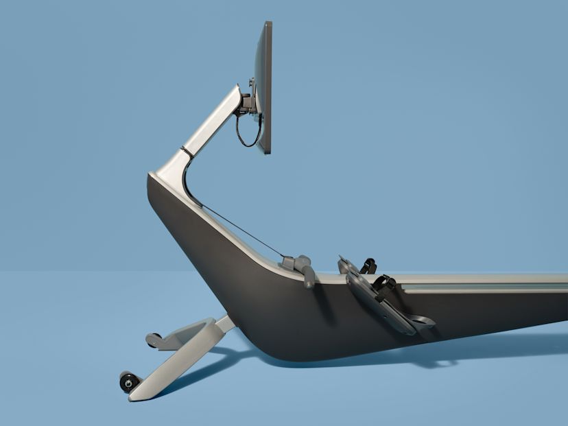 A Hydrow Arc rowing machine against a blue background.