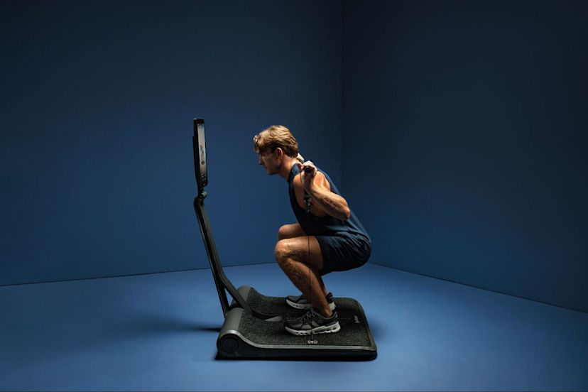 Man does a workout on a LYQUID strength paltform.