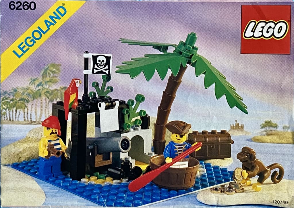 LEGO instruction booklet cover depicting two pirates, a parrot and a monkey with a treasure chest and a cannon under a palm tree on a small island