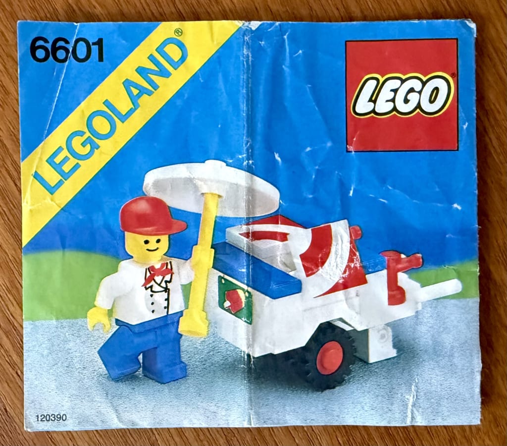 LEGO instruction booklet cover depicting an ice-cream vendor moving the parasol next to their ice-cream cart