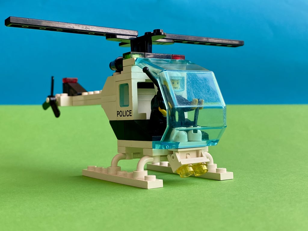 The completed helicopter with the police minifigure at the controls