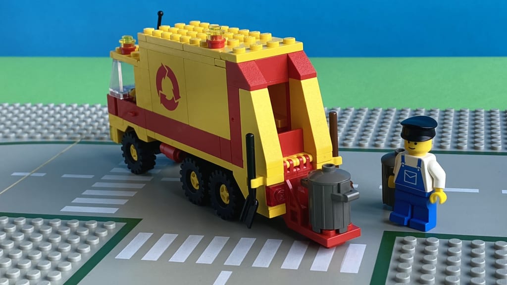 The finished Refuse Collection Truck from the back with a bin placed on the rear loader