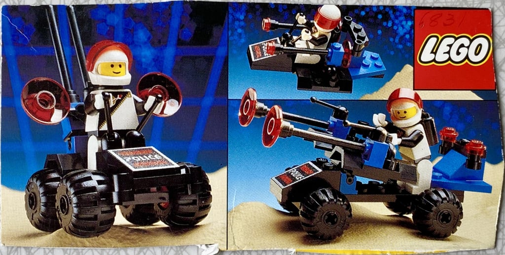 Cutout from LEGO box showing three alternative builds for the Message Decoder: a small 4-wheeled vehicle with a standing minifigure, a small flying spaceship with a sitting minifigure & a minifigure operating some kind of 4-wheeled ground-to-space gun.