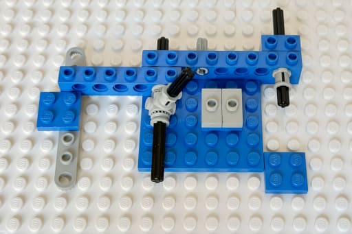 Axles for the right back wheel and the base for the steering added